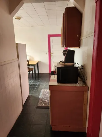 a view of workspace with wooden floor washer and dryer