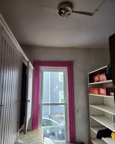 a view of front door and bedroom