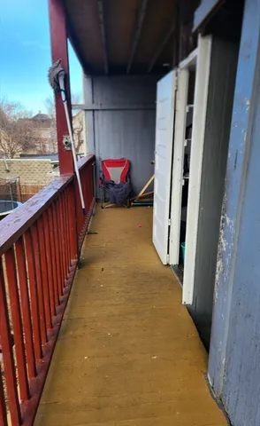 a view of a room with wooden floor and stairs