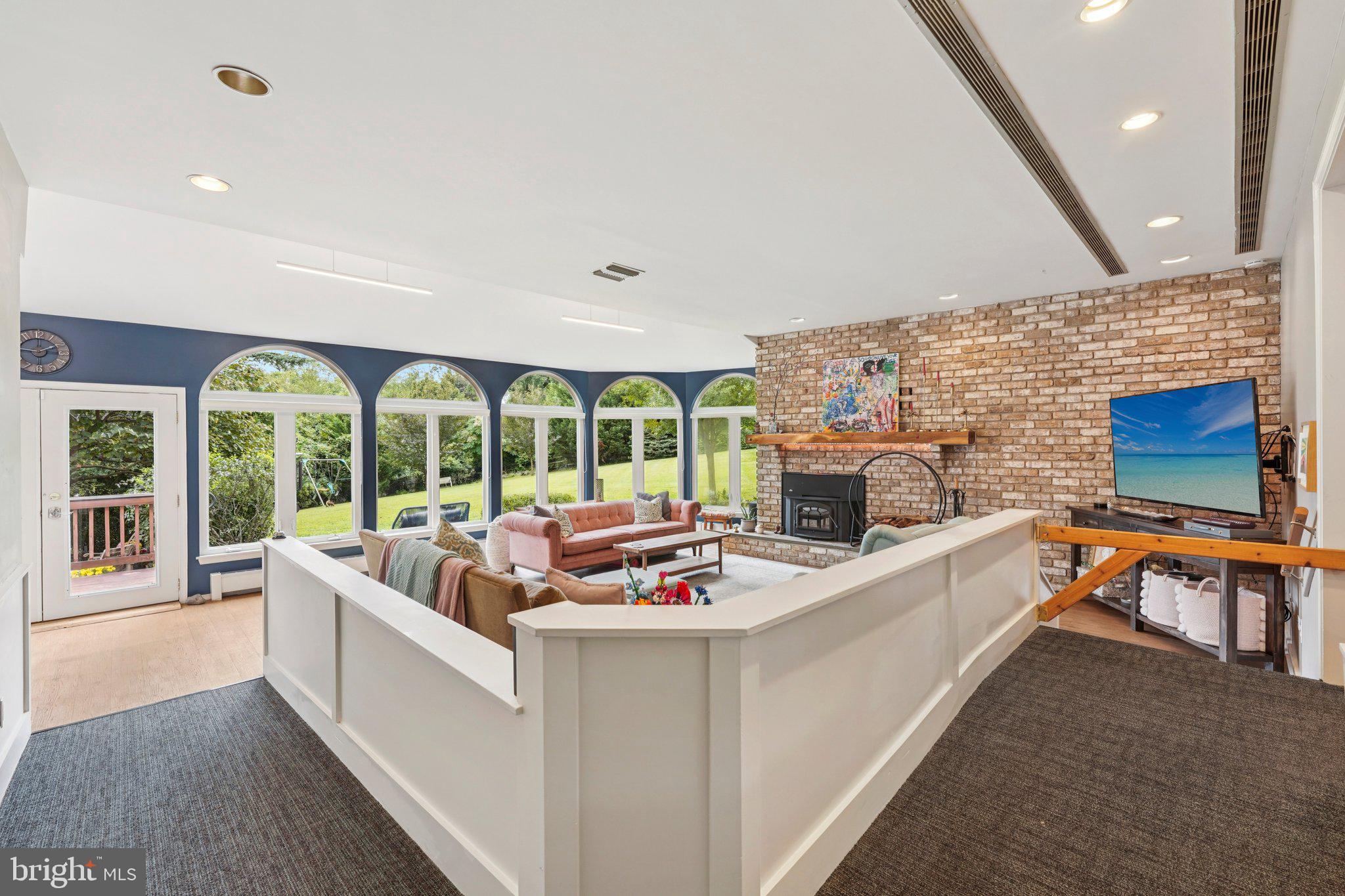 1535 Scrope Road Rydal, PA 19046 - Photo 14 of 63 a living room with fireplace furniture and a large window