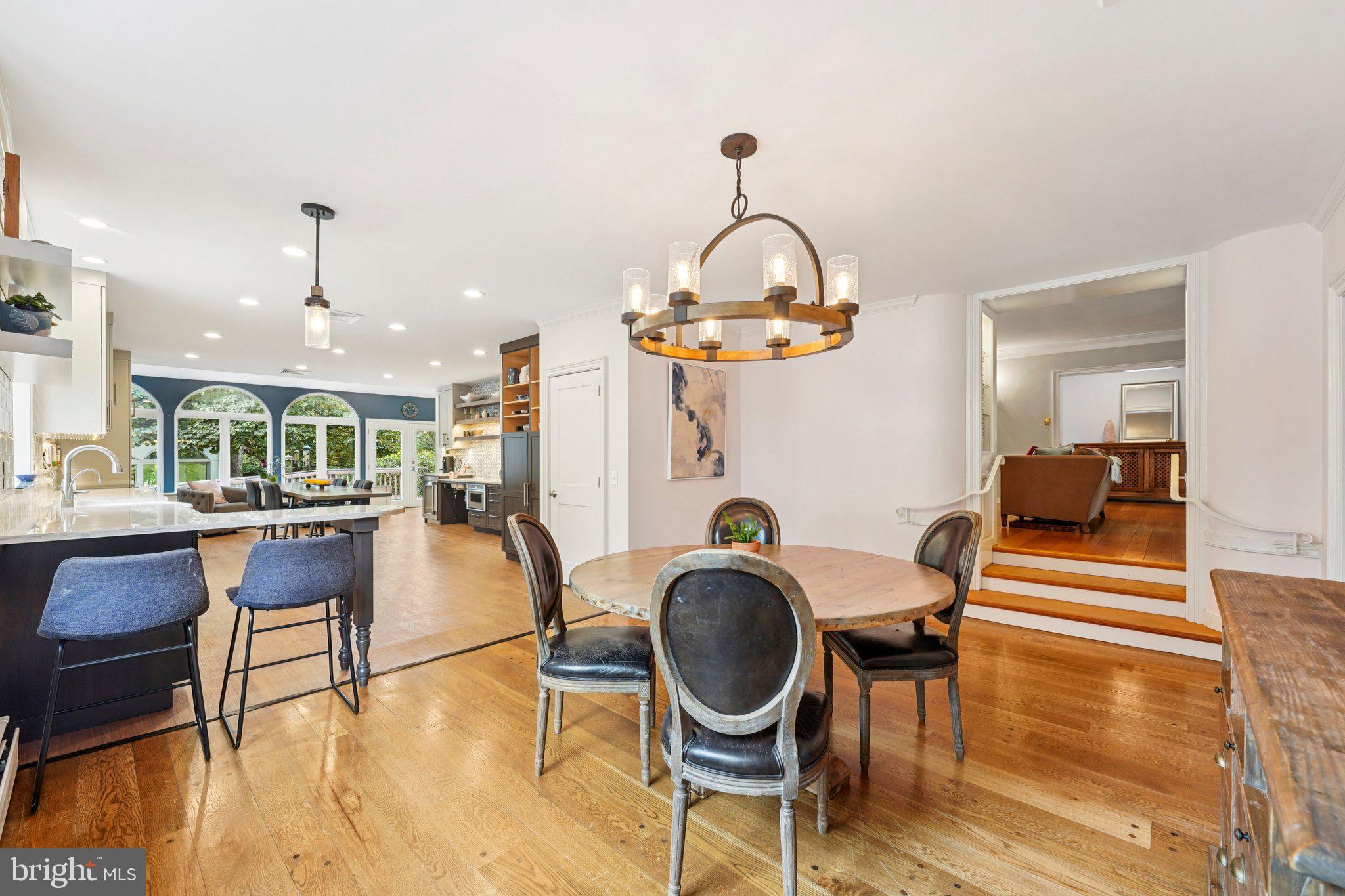 1535 Scrope Road Rydal, PA 19046 - Photo 16 of 63 a view of a dining room with furniture a chandelier and wooden floor