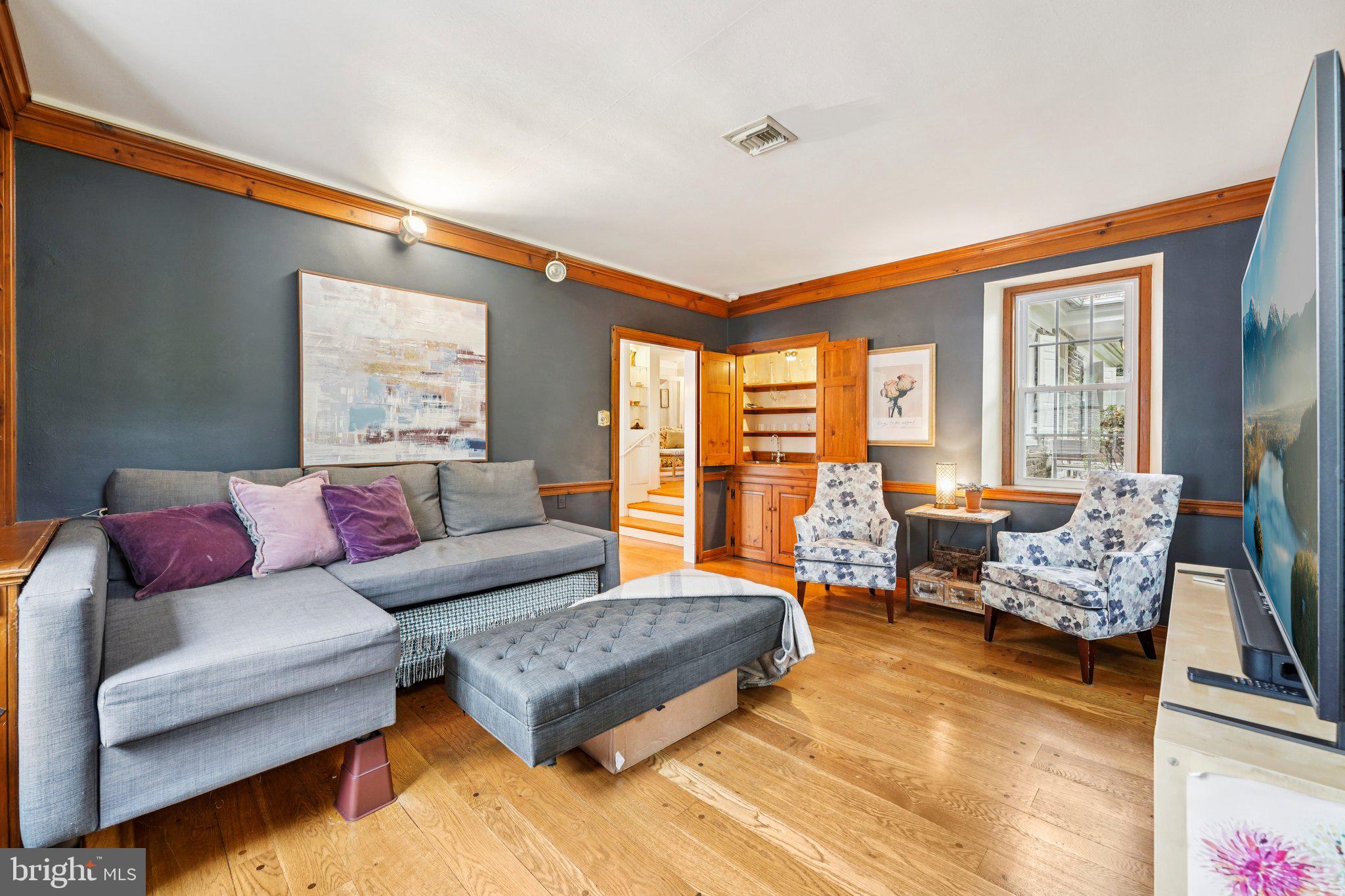 1535 Scrope Road Rydal, PA 19046 - Photo 23 of 63 a living room with furniture and a large window