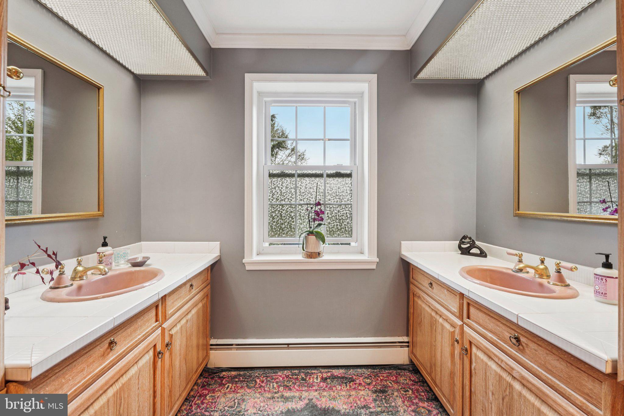 1535 Scrope Road Rydal, PA 19046 - Photo 30 of 63 a bathroom with a sink double vanity and a window
