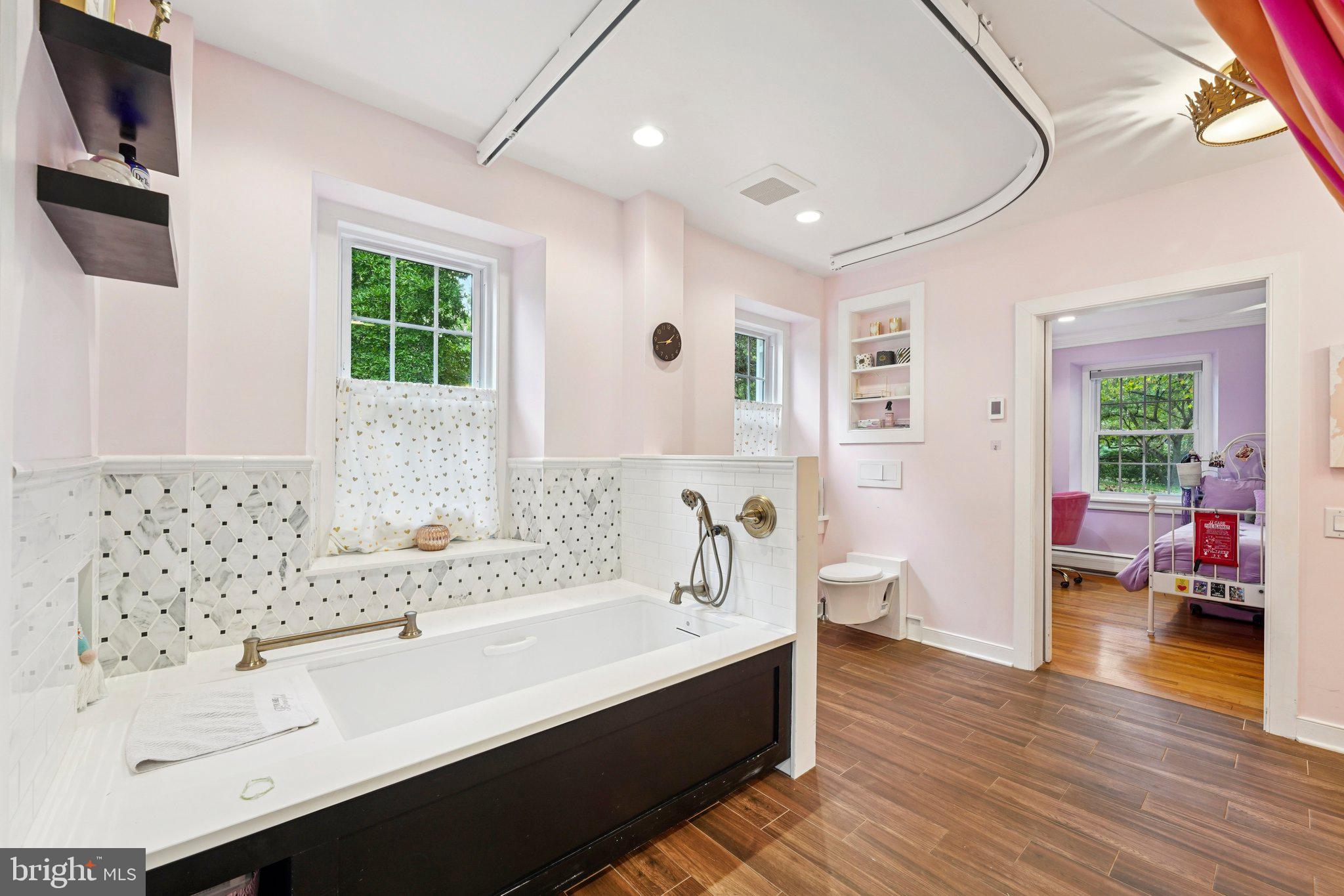 1535 Scrope Road Rydal, PA 19046 - Photo 40 of 63 a bathroom with a sink a mirror and a bathtub