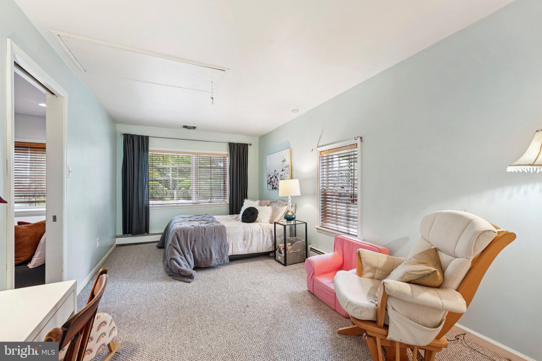 1535 Scrope Road Rydal, PA 19046 - Photo 45 of 63 a spacious bedroom with a bed and glass window