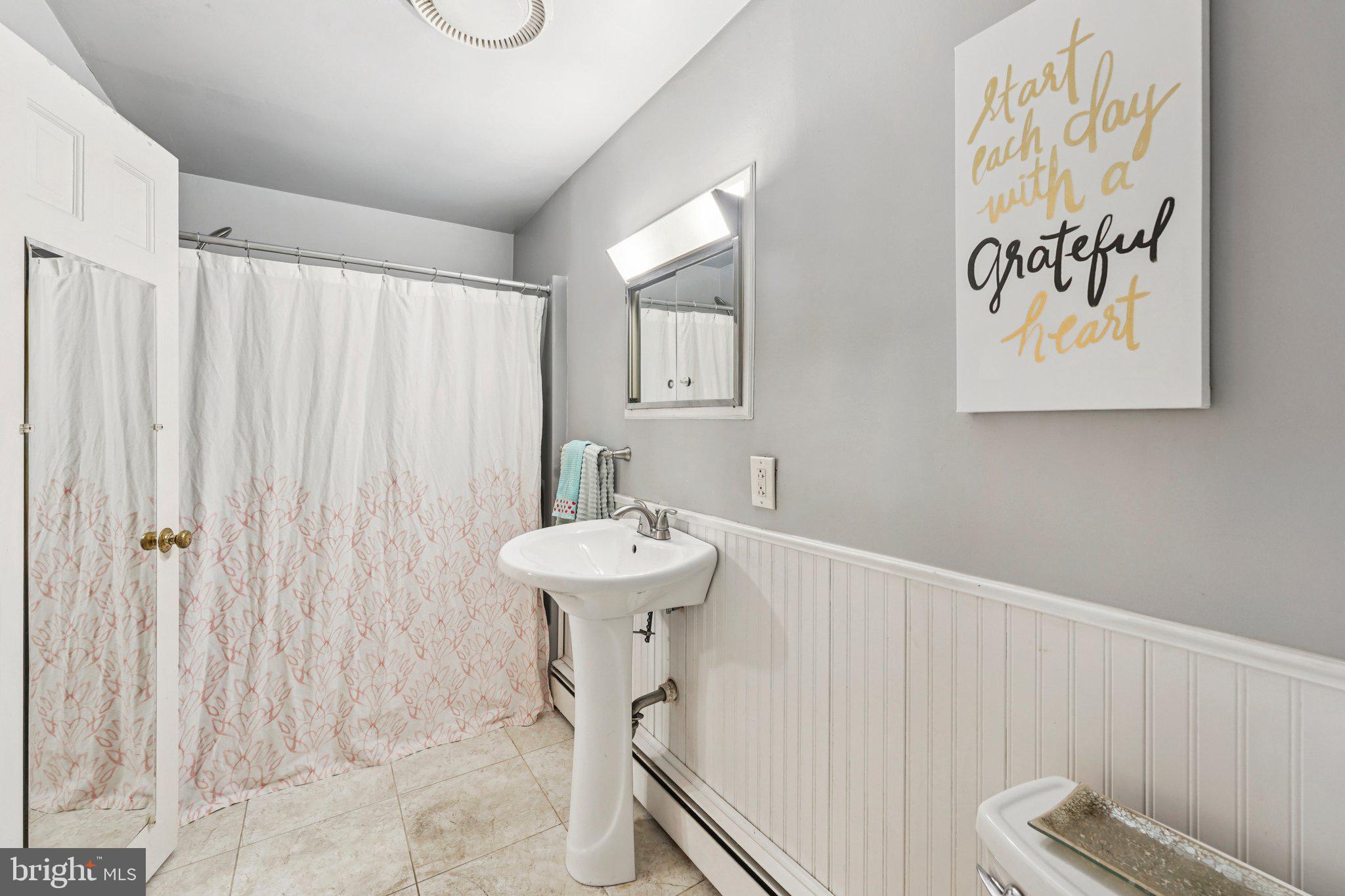 1535 Scrope Road Rydal, PA 19046 - Photo 47 of 63 a bathroom with a sink a toilet and a shower