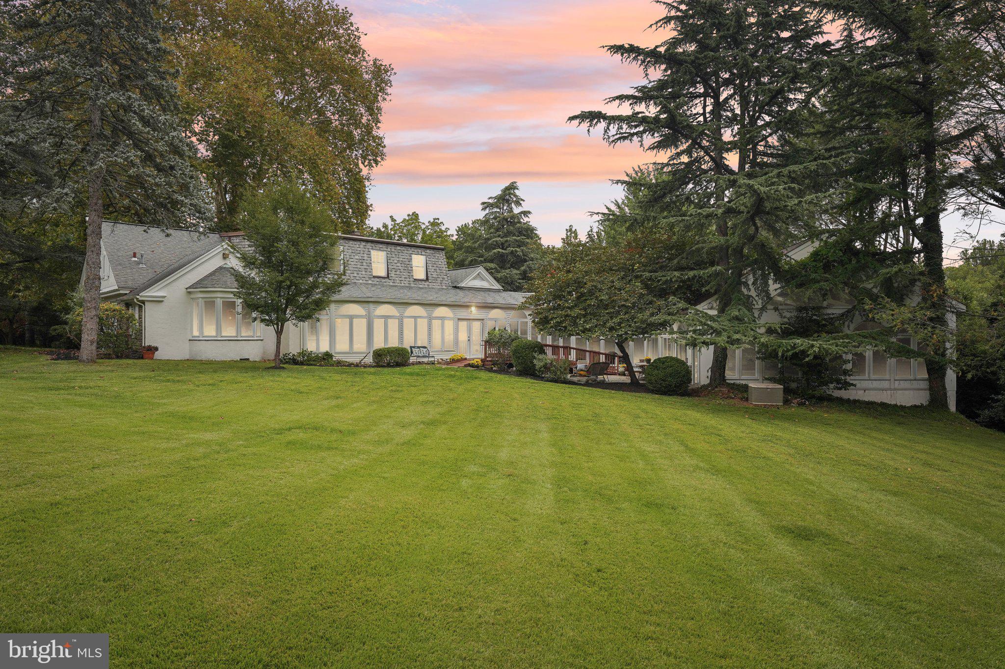 1535 Scrope Road Rydal, PA 19046 - Photo 5 of 63 a view of a house with a big yard and large trees