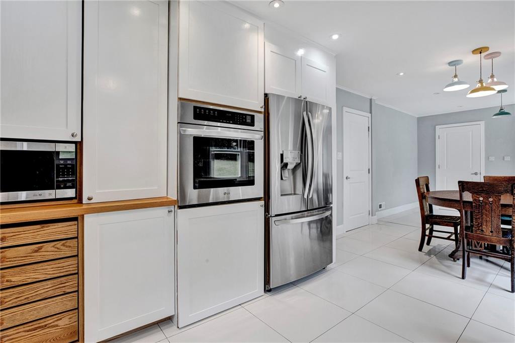 113 Duncan Circle Beaver, PA 15009 - Photo 13 of 44 a kitchen with stainless steel appliances a refrigerator stove and microwave