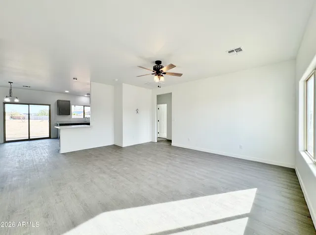 a view of a kitchen with a sink and a stove top oven