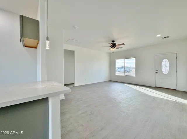 a view of an empty room with a window