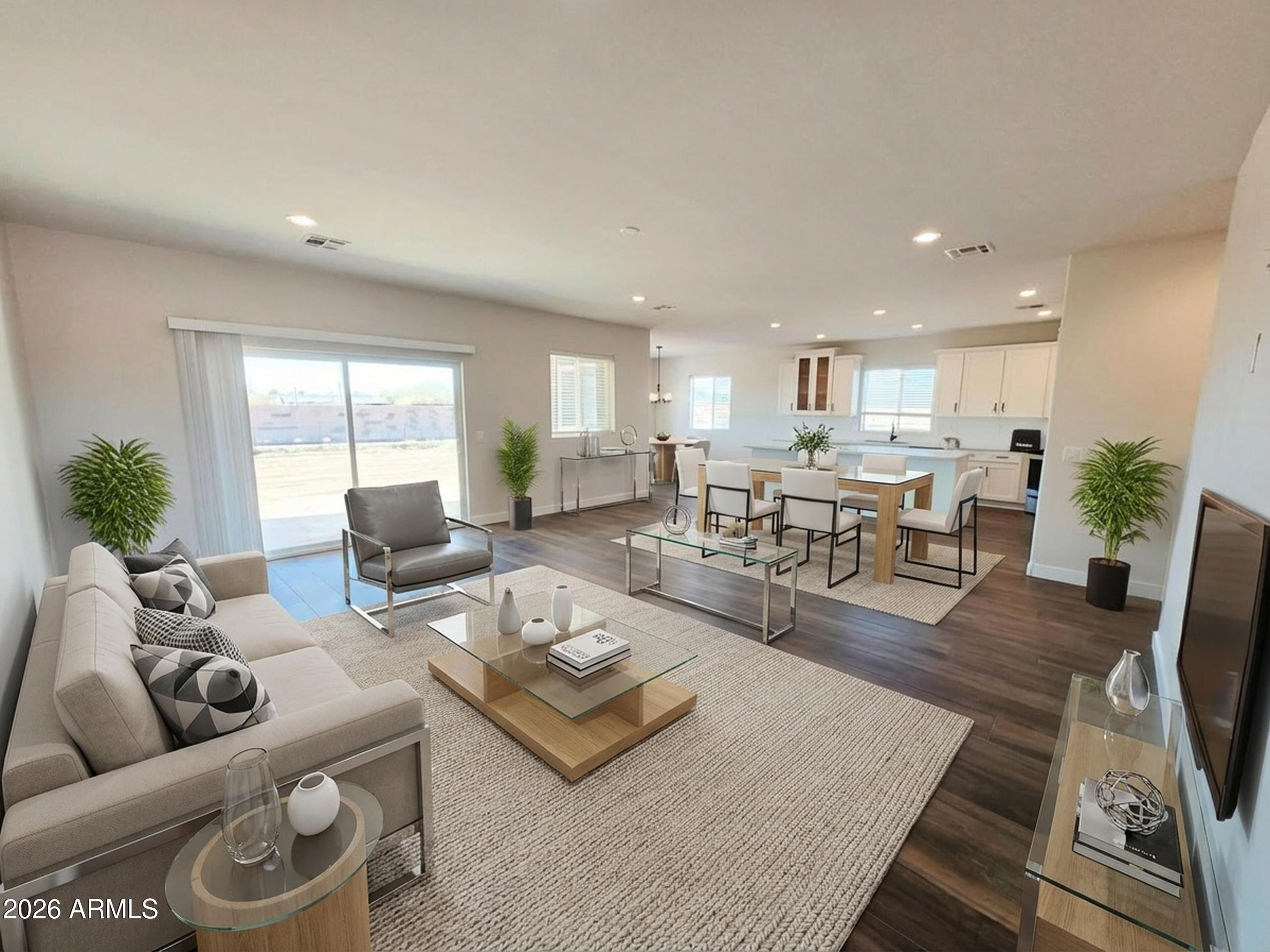 20735 West Elliot Road Buckeye, AZ 85326 - Photo 11 of 59 a living room with furniture and a wooden floor