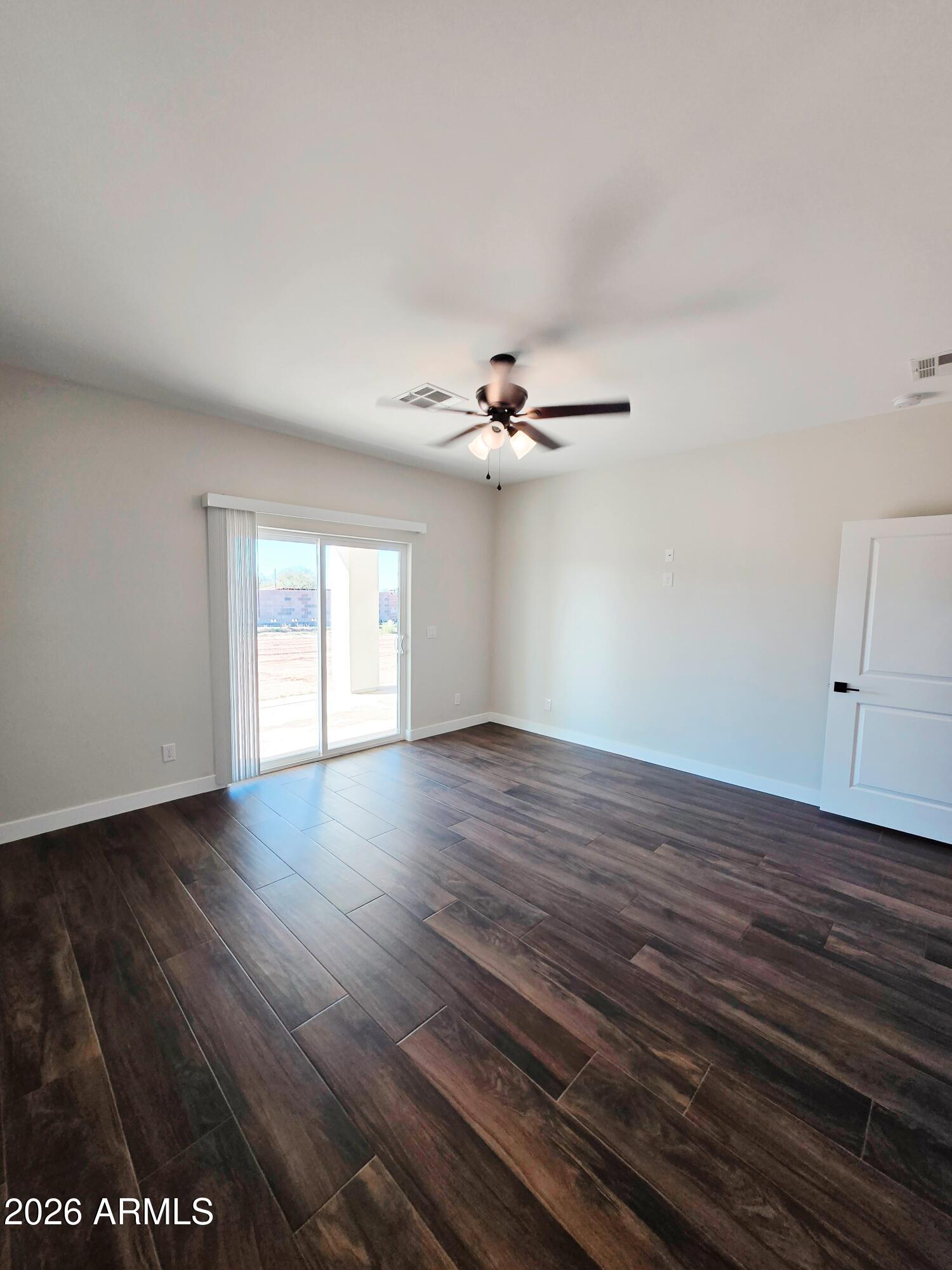 20735 West Elliot Road Buckeye, AZ 85326 - Photo 25 of 59 a view of a livingroom with wooden floor