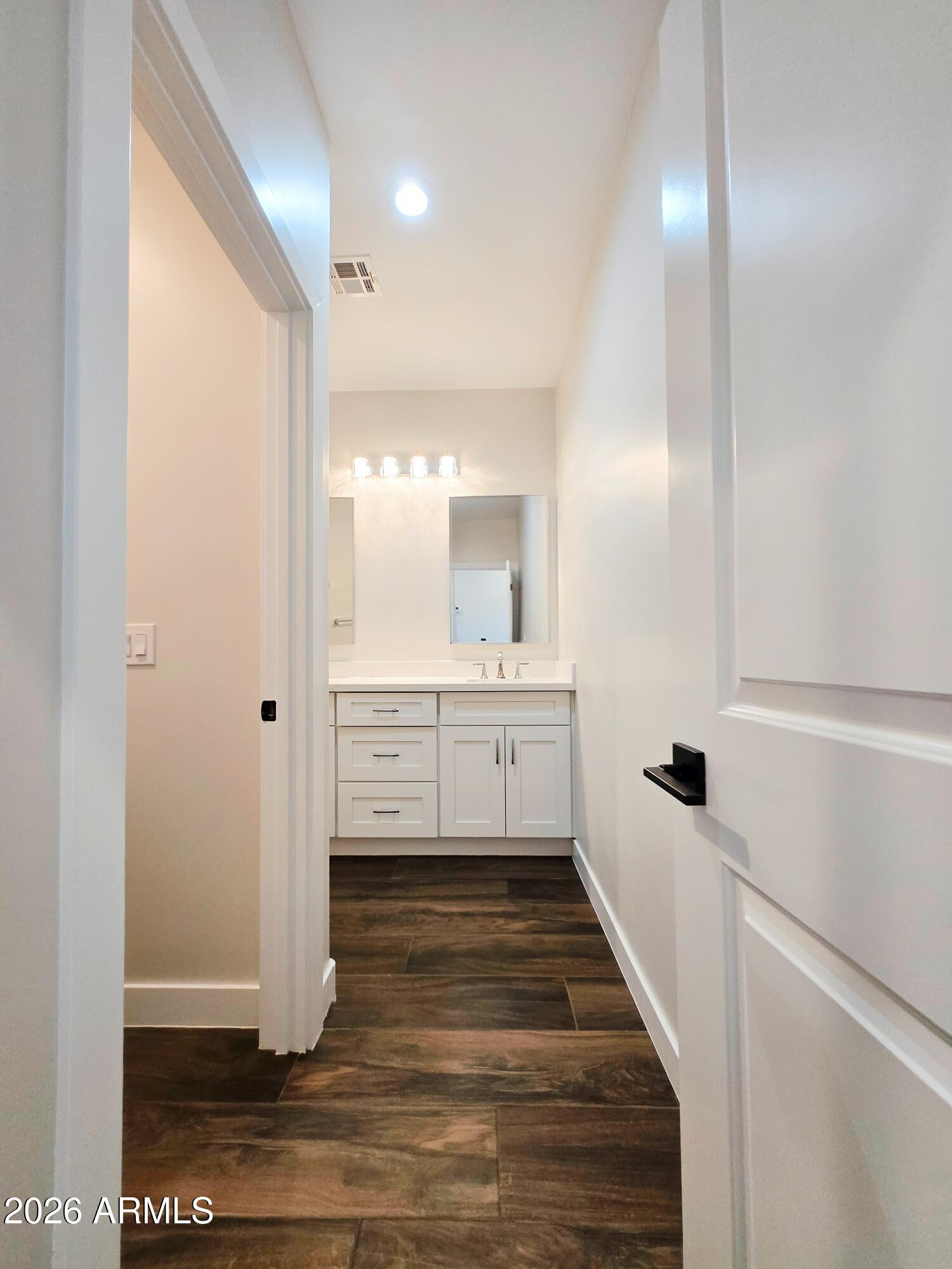 20735 West Elliot Road Buckeye, AZ 85326 - Photo 34 of 59 a bathroom with a sink and a mirror