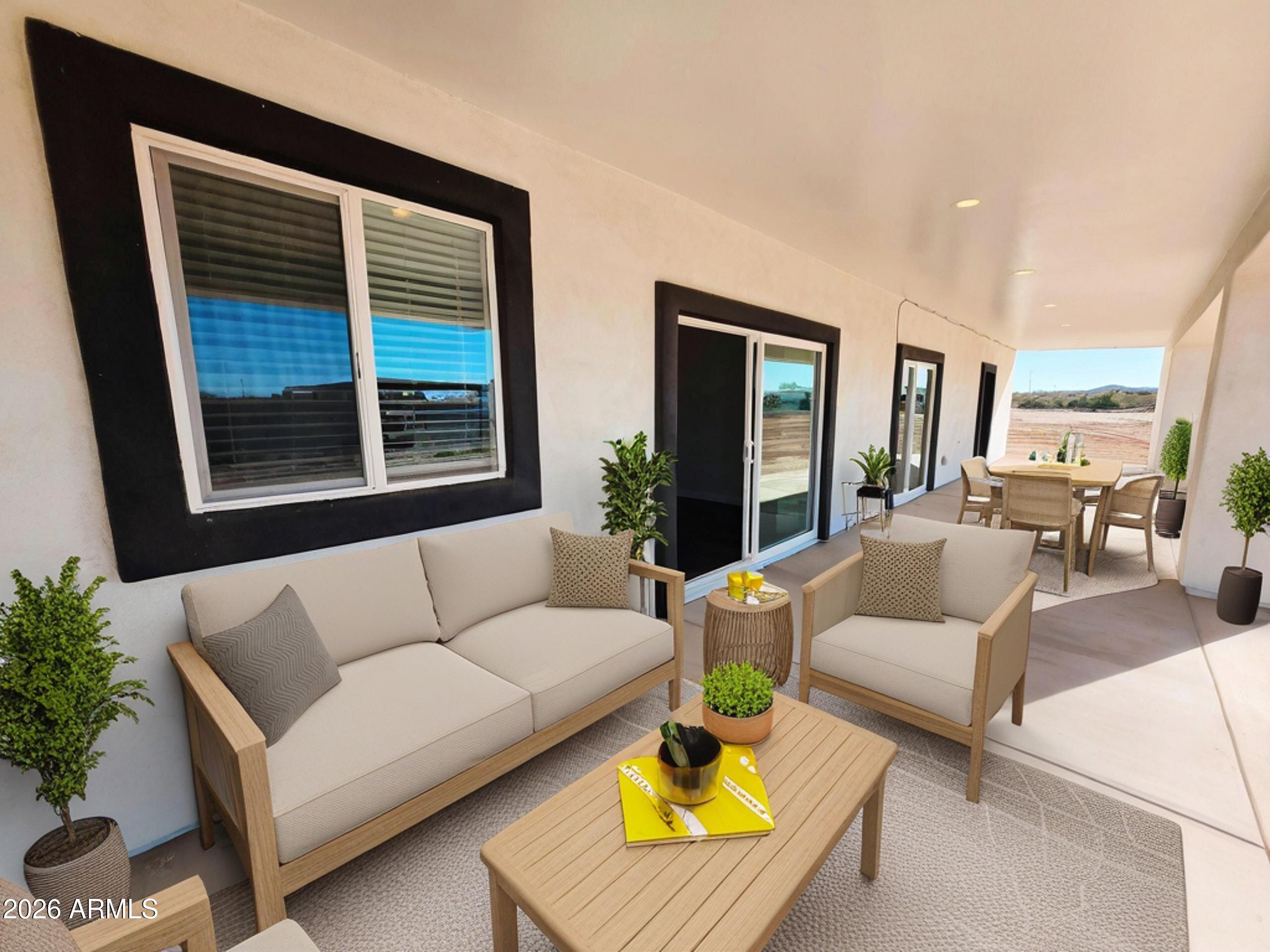 20735 West Elliot Road Buckeye, AZ 85326 - Photo 50 of 59 a living room with furniture and a large window