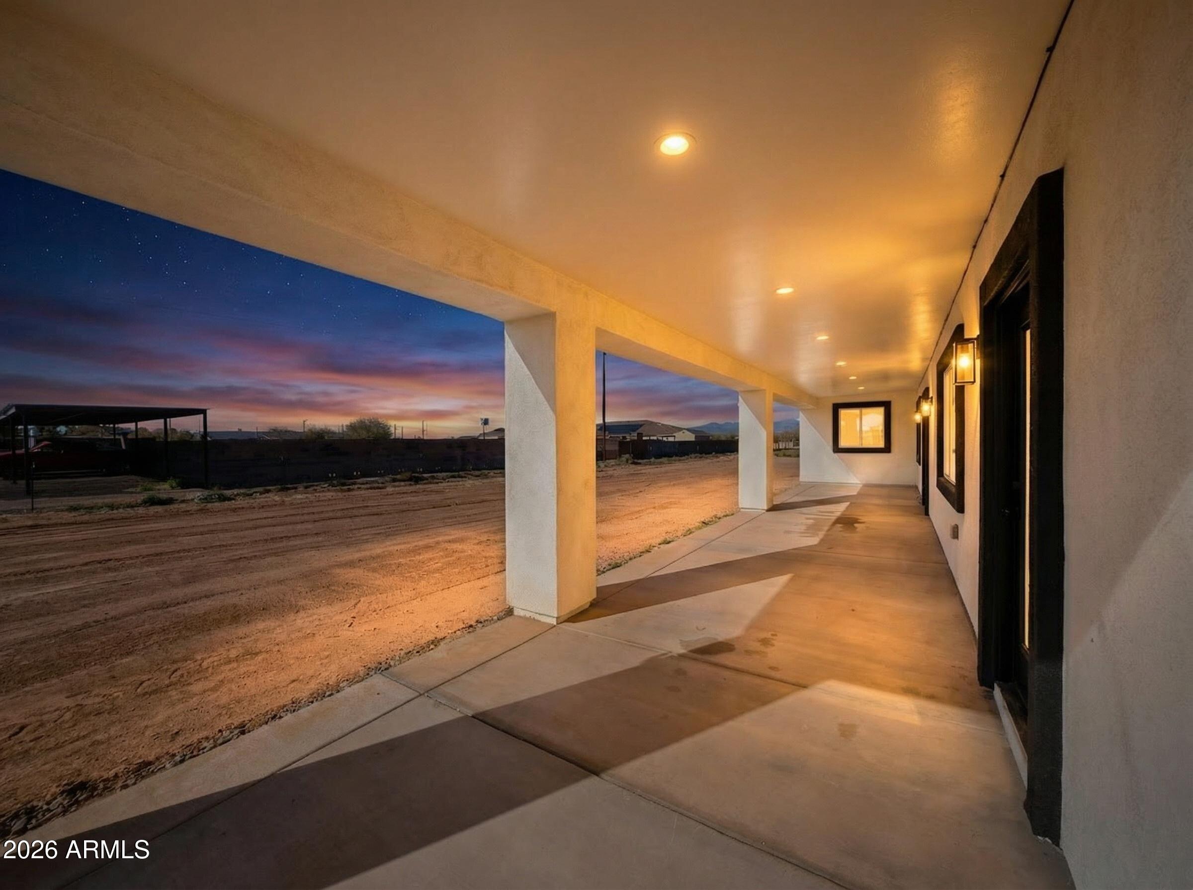 20735 West Elliot Road Buckeye, AZ 85326 - Photo 52 of 59 a view of a hallway with an outdoor space