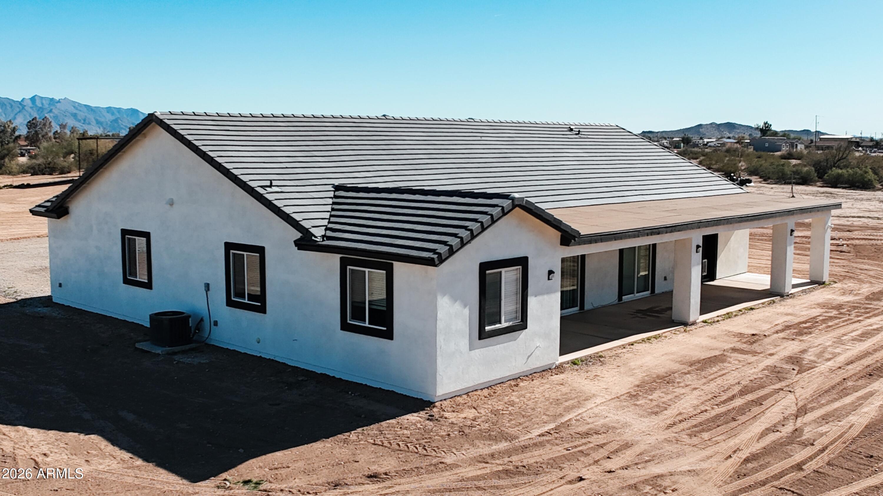 20735 West Elliot Road Buckeye, AZ 85326 - Photo 56 of 59 a house view with a backyard space