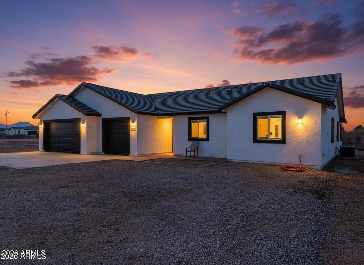 20735 West Elliot Road Buckeye, AZ 85326 - Photo 5 of 59 a front view of a house with a yard
