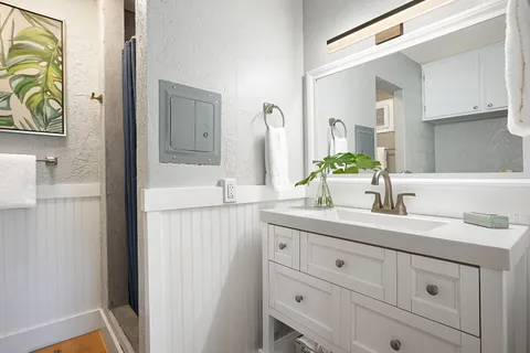 a bathroom with a sink and a mirror