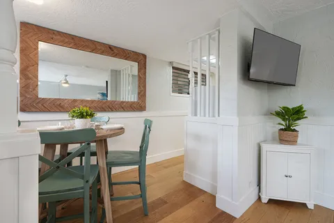 a view of kitchen with furniture and wooden floor