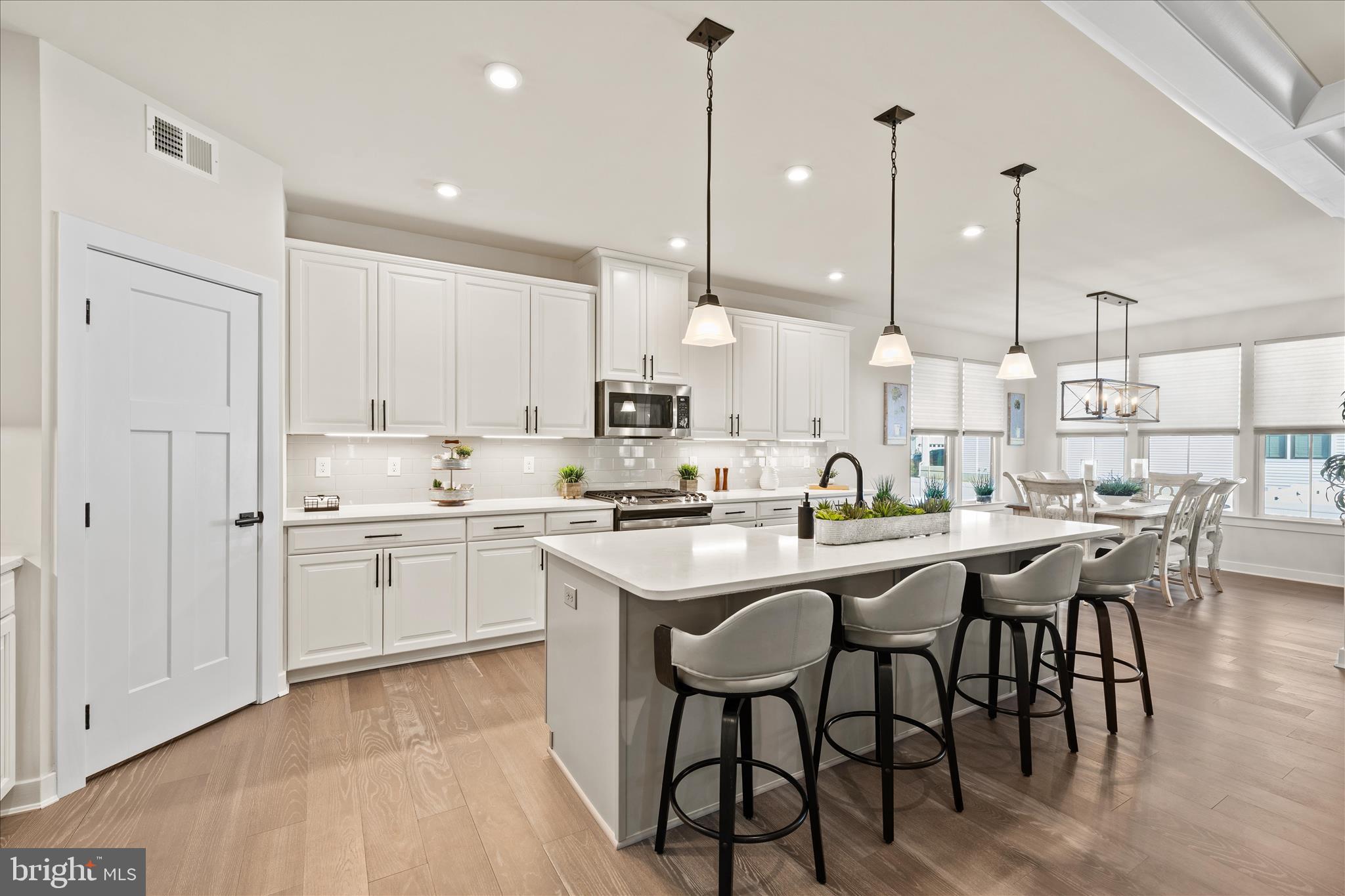 32225 Heritage Road Lewes, DE 19958 - Photo 11 of 74 a kitchen with appliances a sink and cabinets