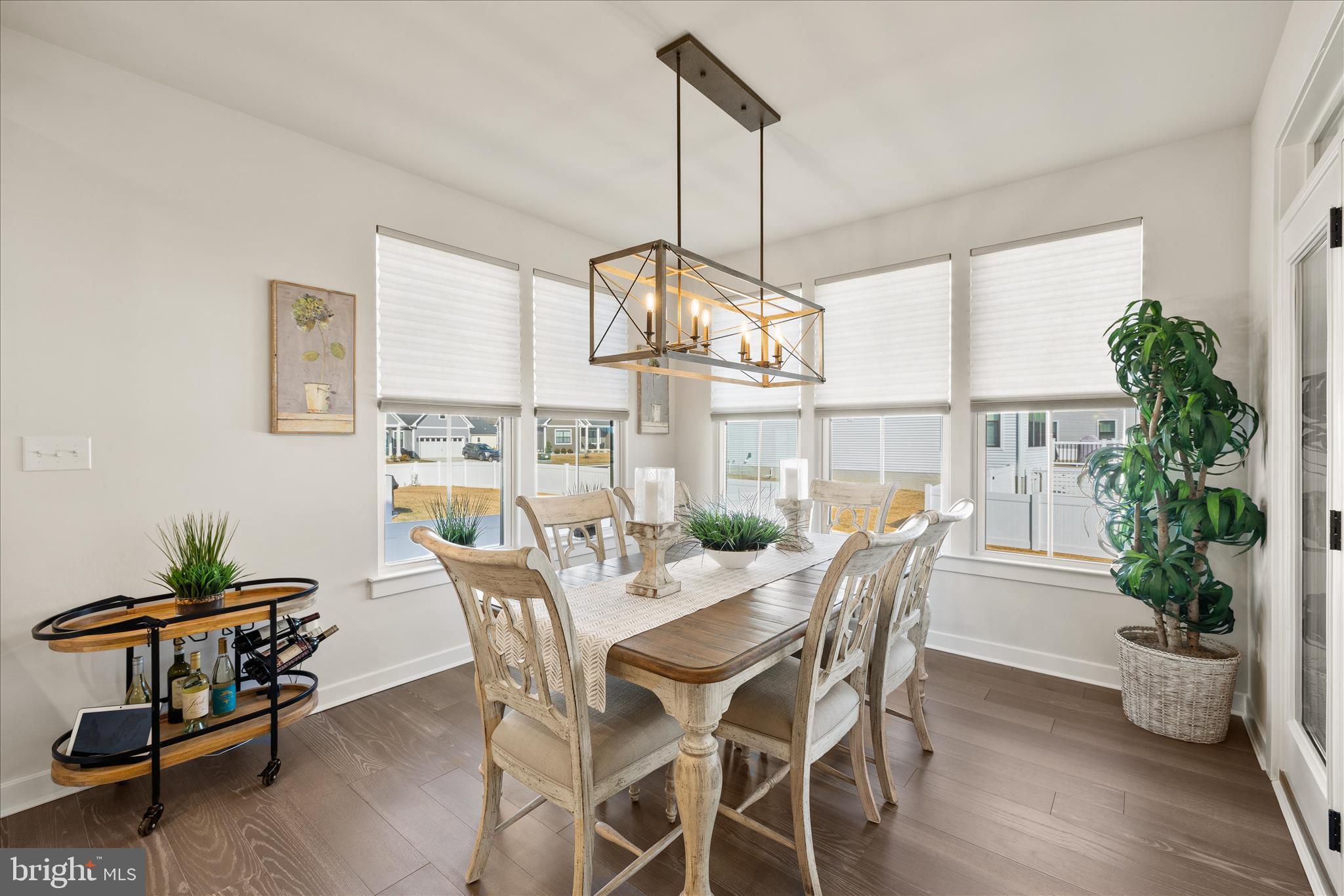 32225 Heritage Road Lewes, DE 19958 - Photo 17 of 74 a view of a dining room with furniture window and wooden floor