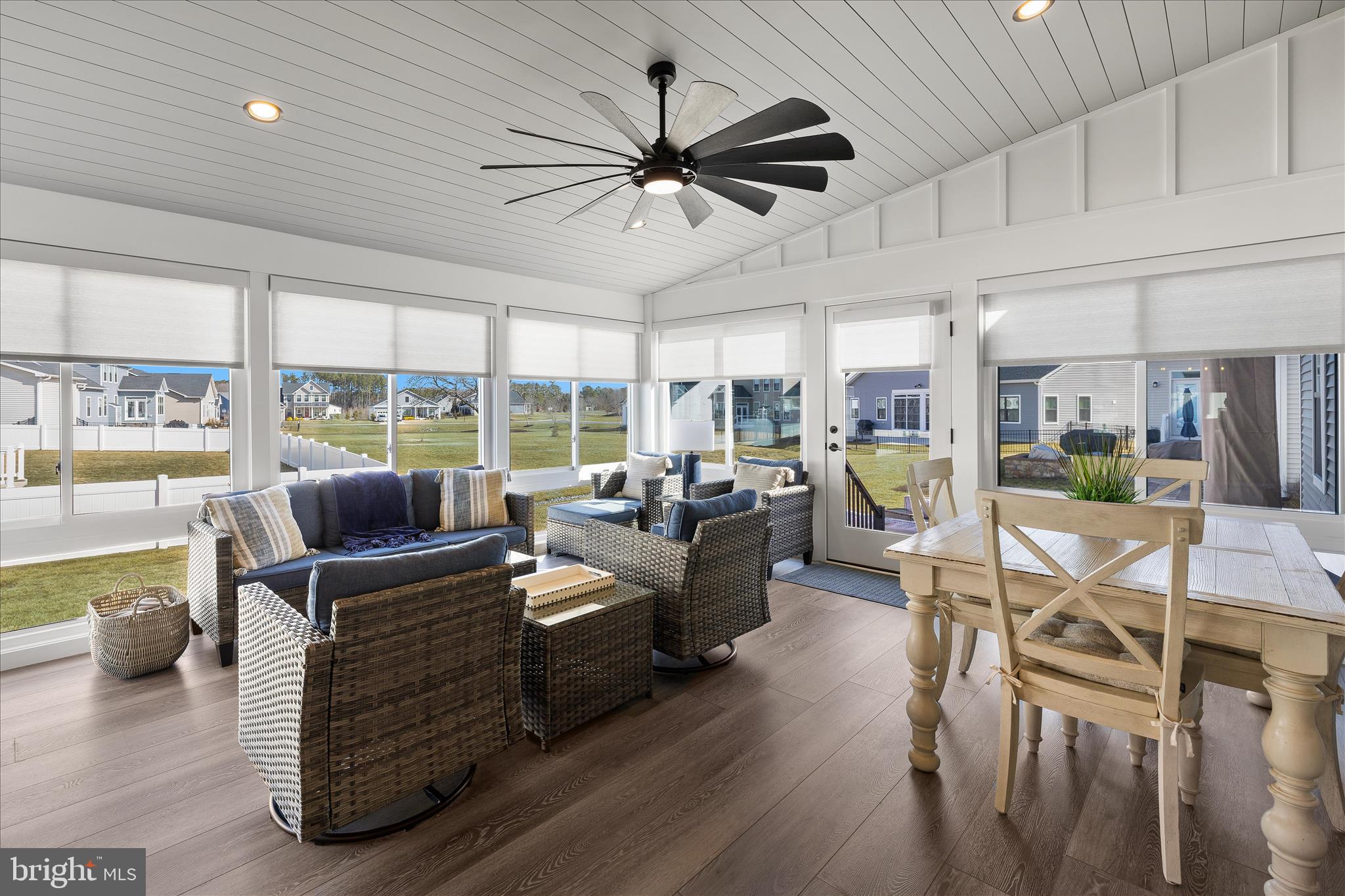 32225 Heritage Road Lewes, DE 19958 - Photo 18 of 74 a living room with furniture kitchen area and a large window