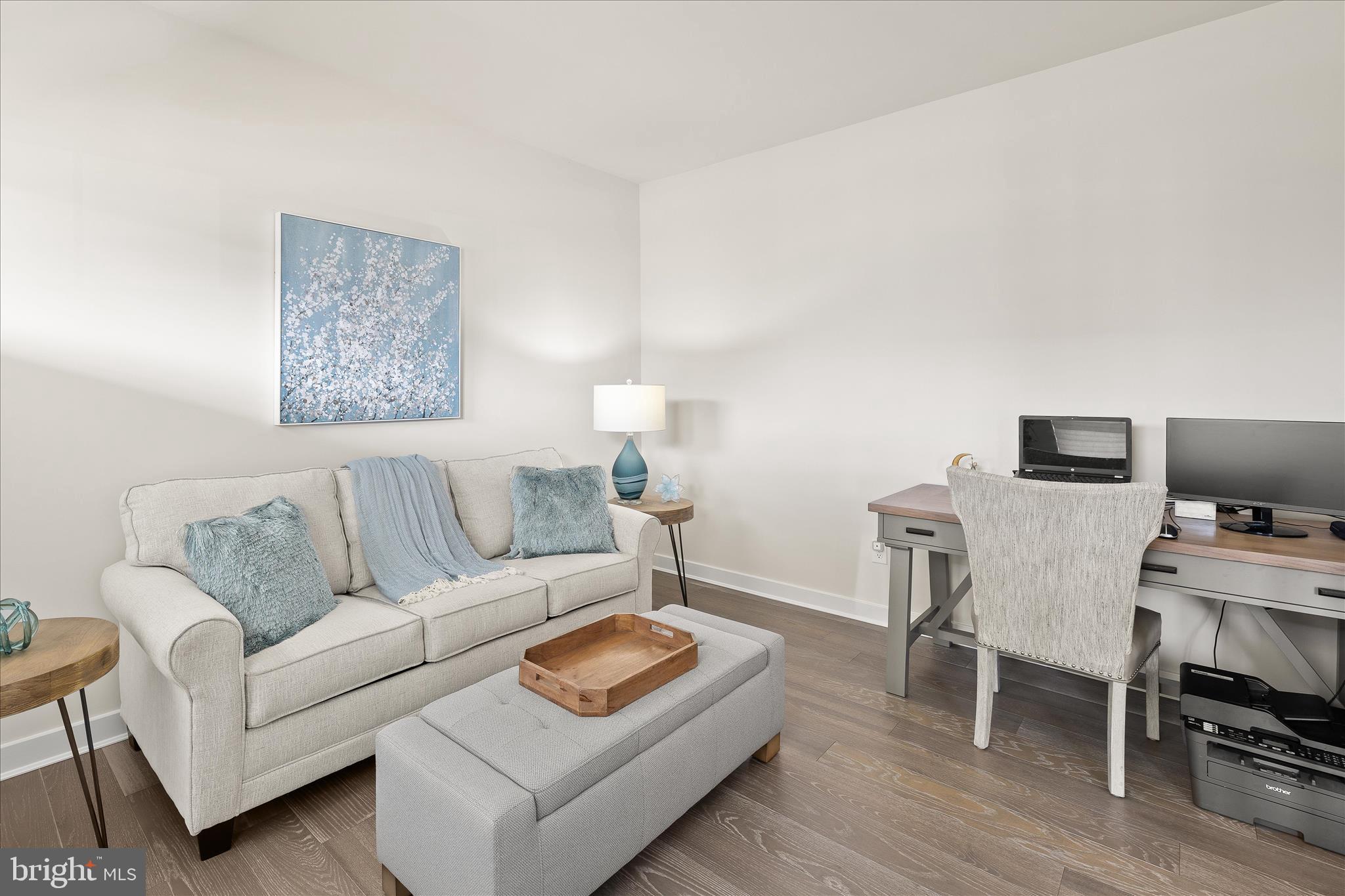 32225 Heritage Road Lewes, DE 19958 - Photo 31 of 74 a living room with furniture and a flat screen tv