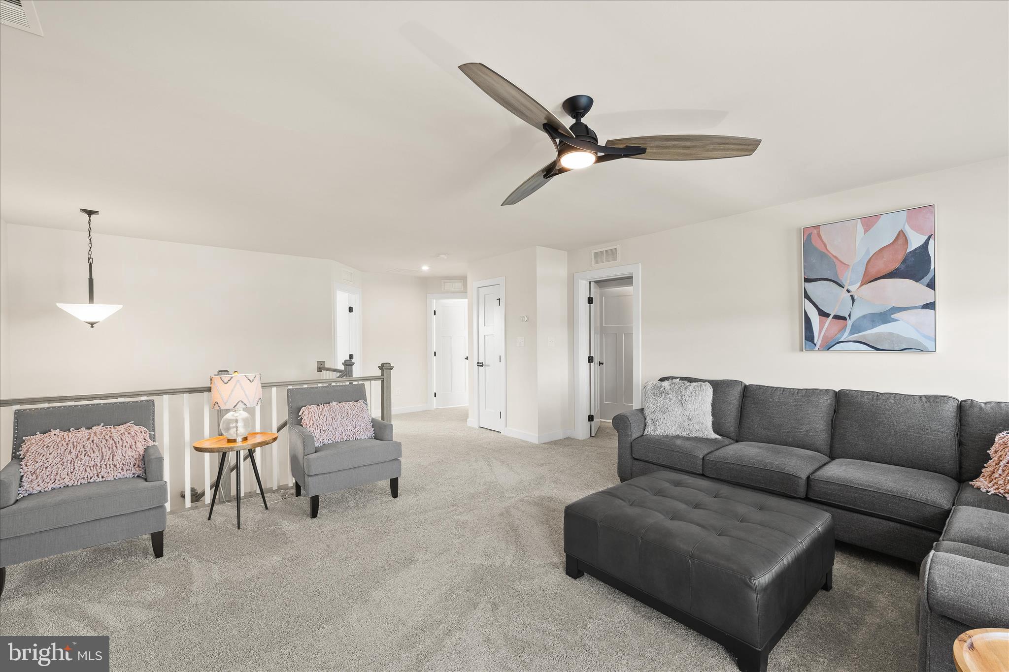 32225 Heritage Road Lewes, DE 19958 - Photo 38 of 74 a living room with furniture and a couch