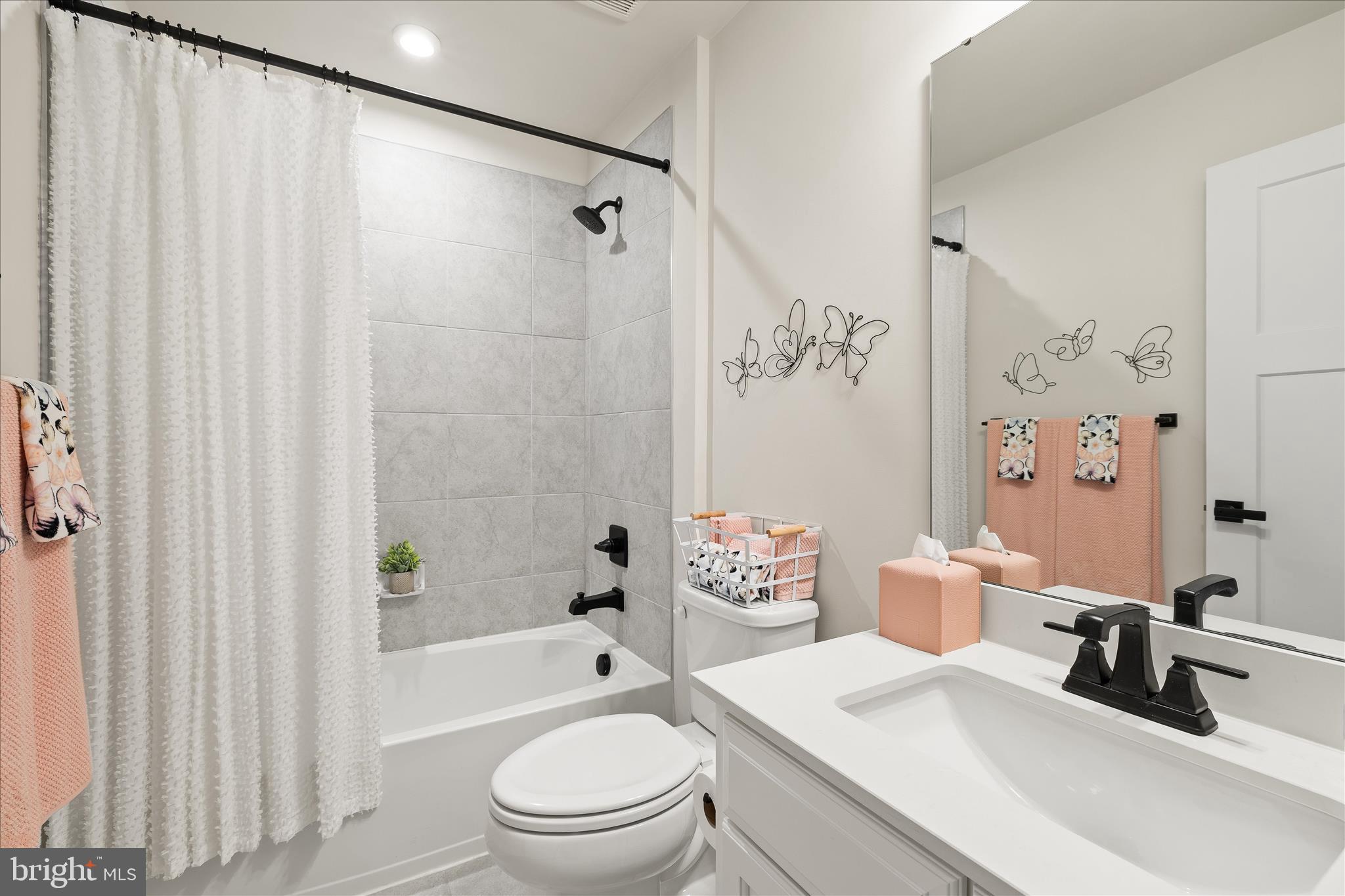 32225 Heritage Road Lewes, DE 19958 - Photo 42 of 74 a bathroom with a sink toilet and shower