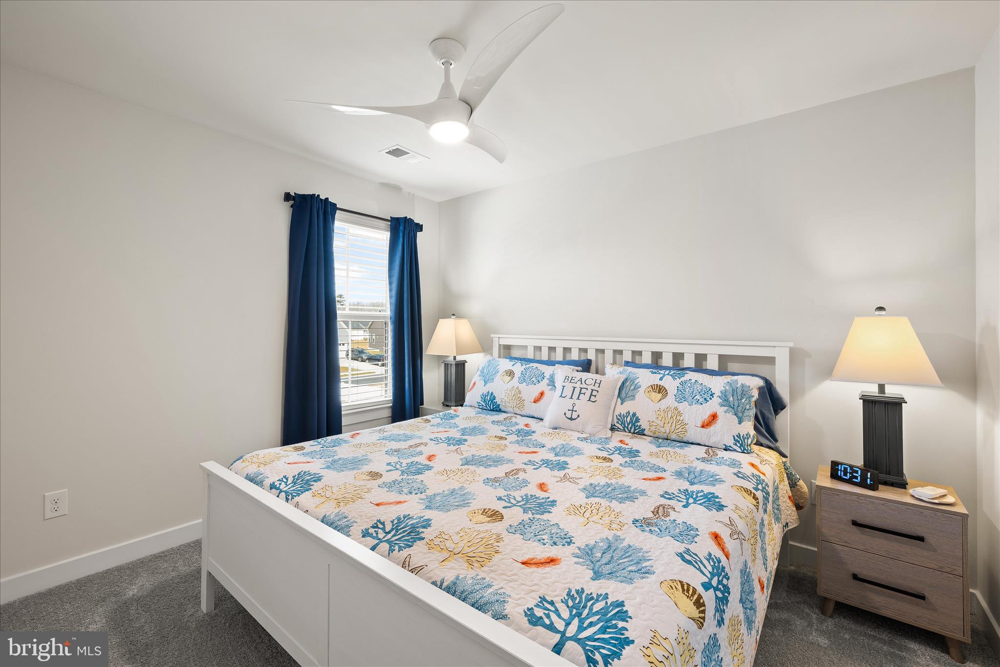 32225 Heritage Road Lewes, DE 19958 - Photo 43 of 74 a bedroom with a bed and a chandelier