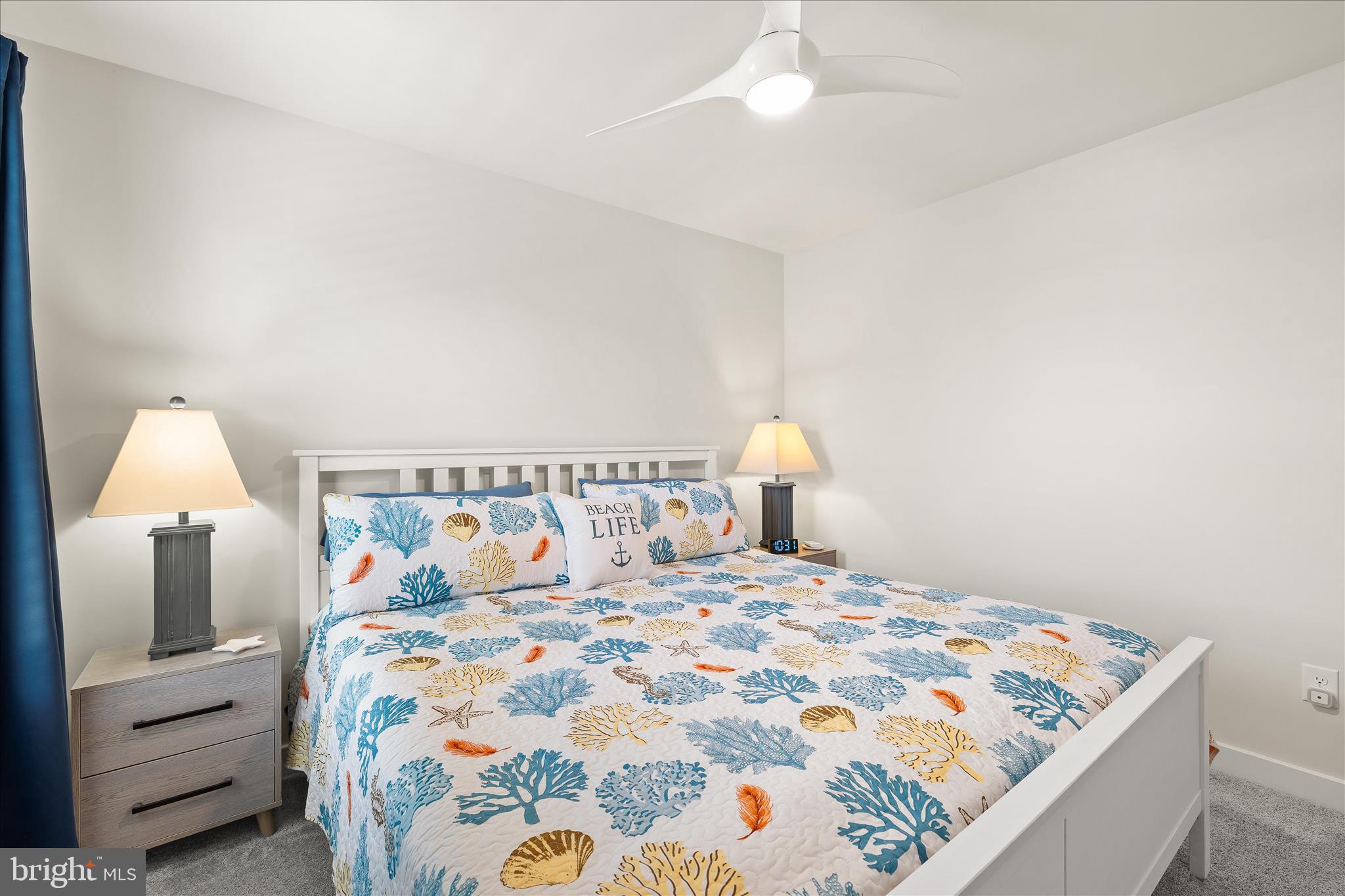 32225 Heritage Road Lewes, DE 19958 - Photo 45 of 74 a bedroom with a bed and a lamp