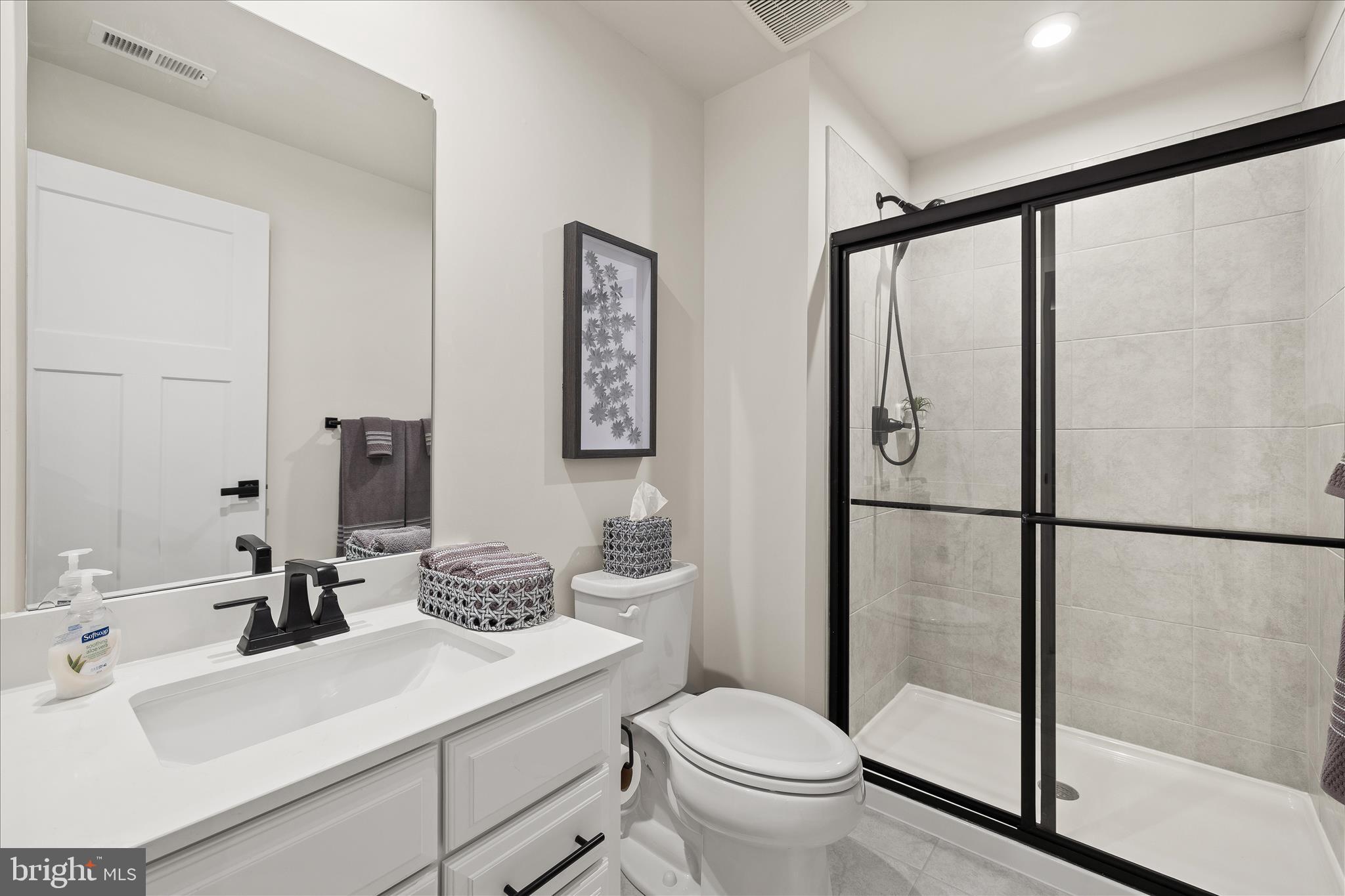 32225 Heritage Road Lewes, DE 19958 - Photo 53 of 74 a bathroom with a sink toilet and shower