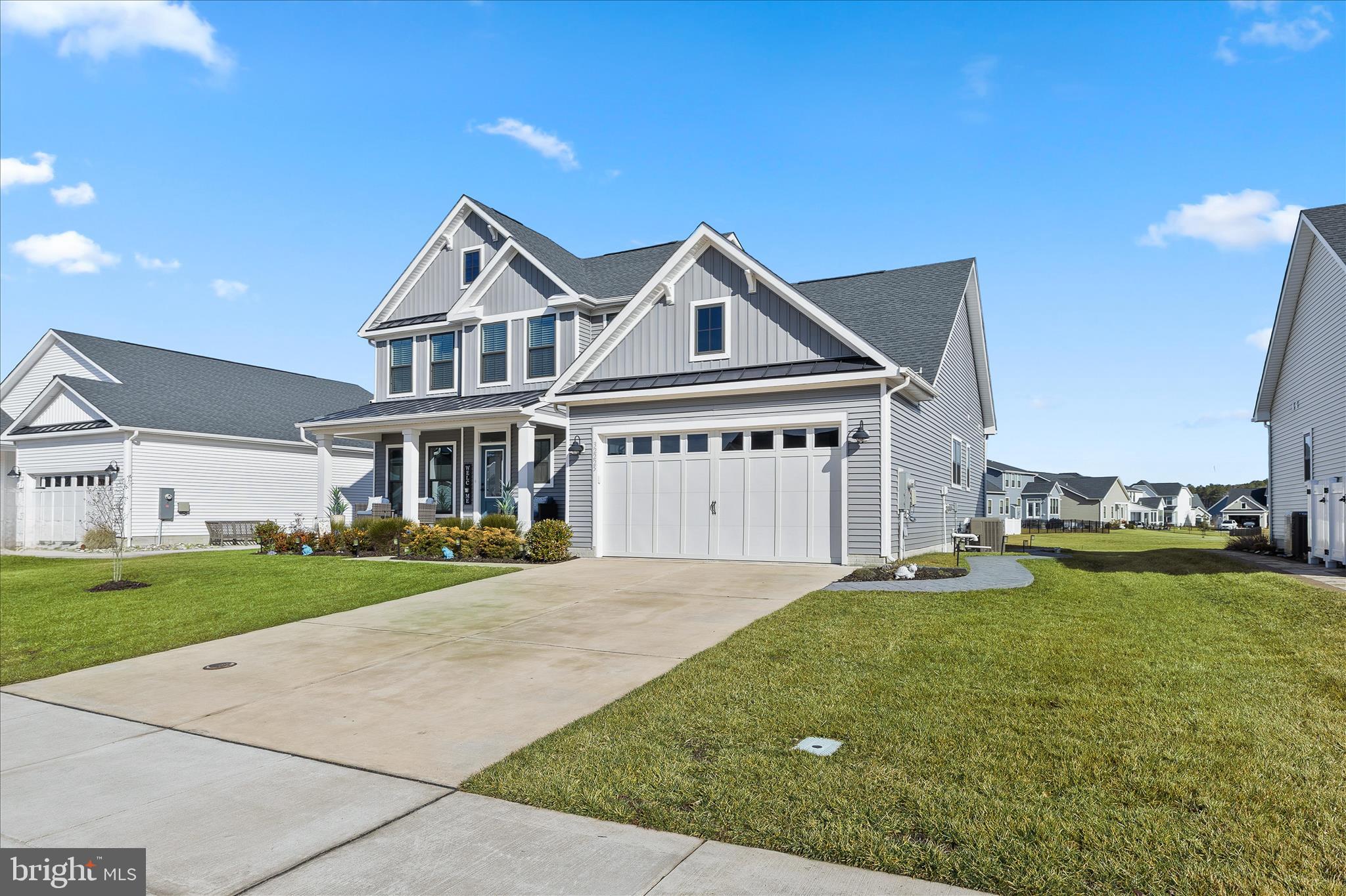 32225 Heritage Road Lewes, DE 19958 - Photo 56 of 74 a view of a big house with a big yard and large trees