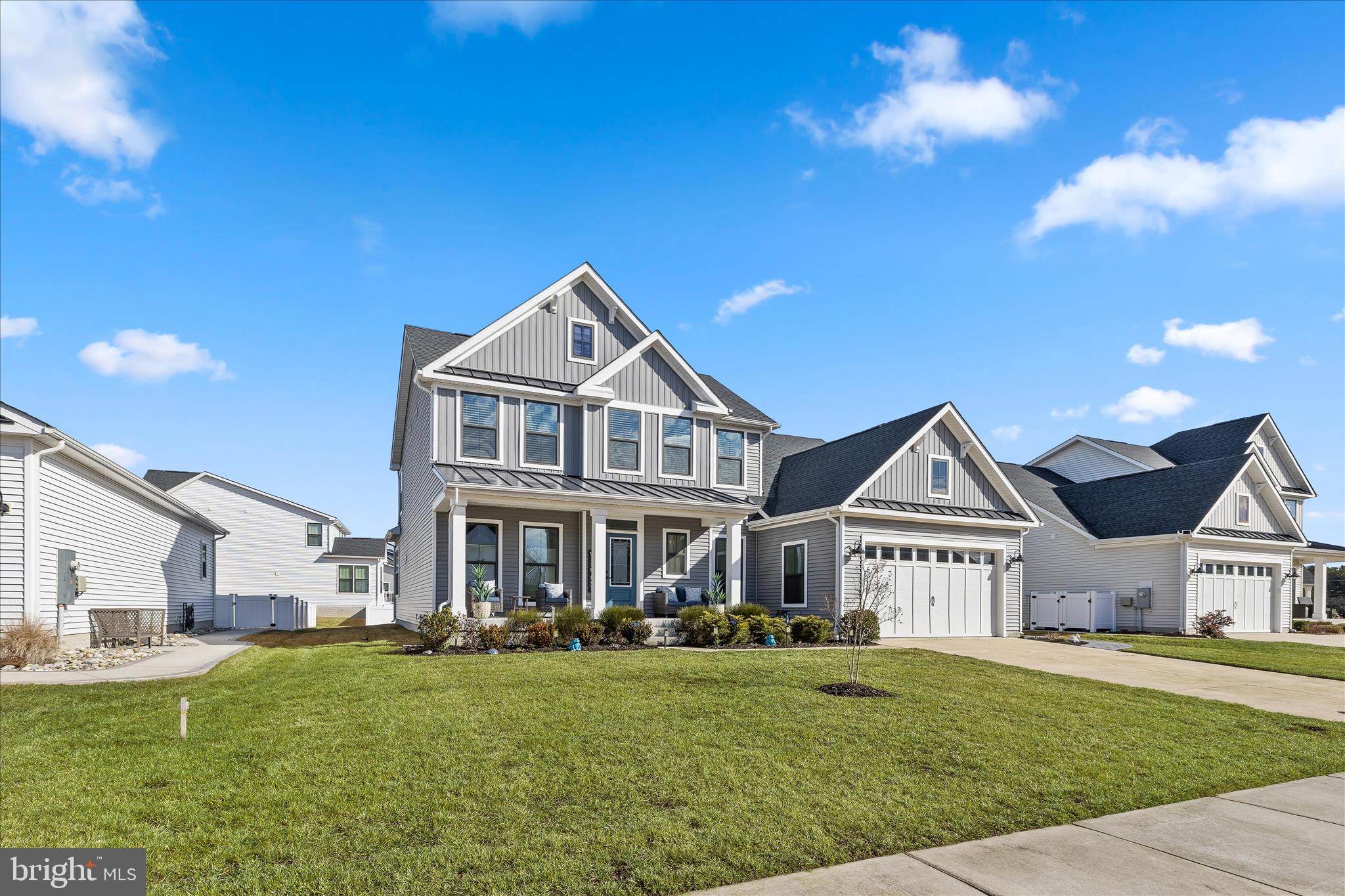 32225 Heritage Road Lewes, DE 19958 - Photo 57 of 74 a front view of a house with a yard