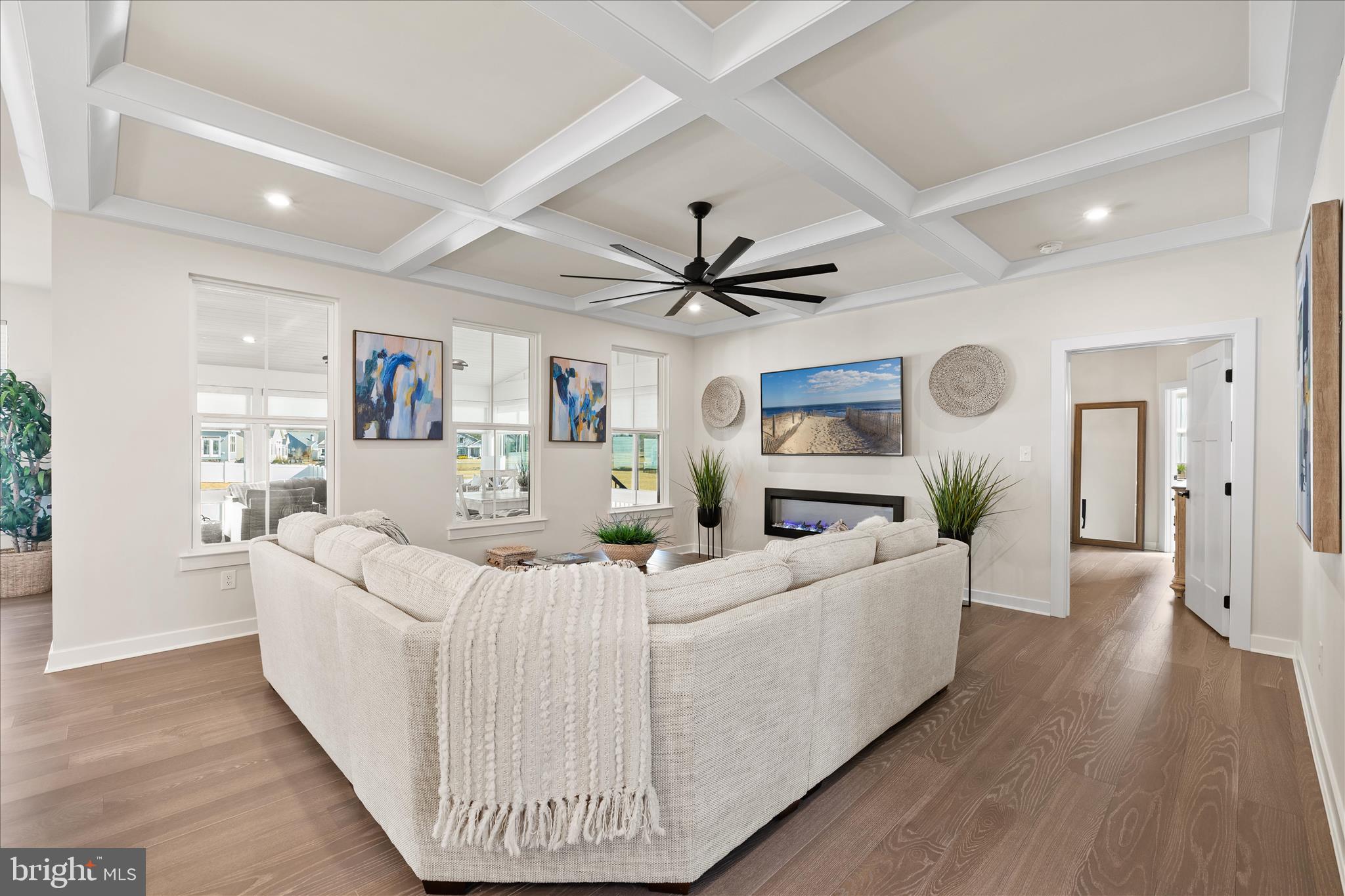 32225 Heritage Road Lewes, DE 19958 - Photo 6 of 74 a living room with furniture and a wooden floor