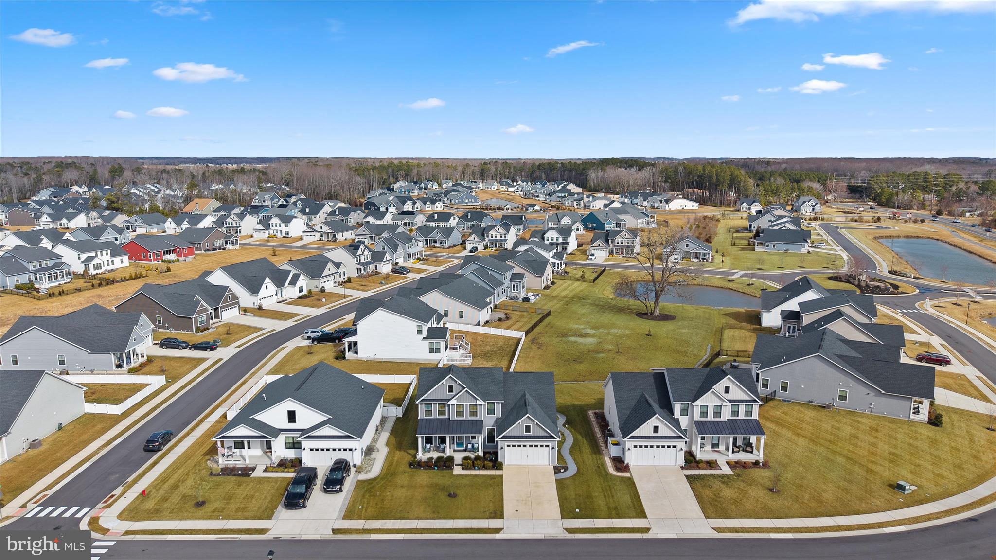 32225 Heritage Road Lewes, DE 19958 - Photo 62 of 74 an aerial view of residential houses with outdoor space