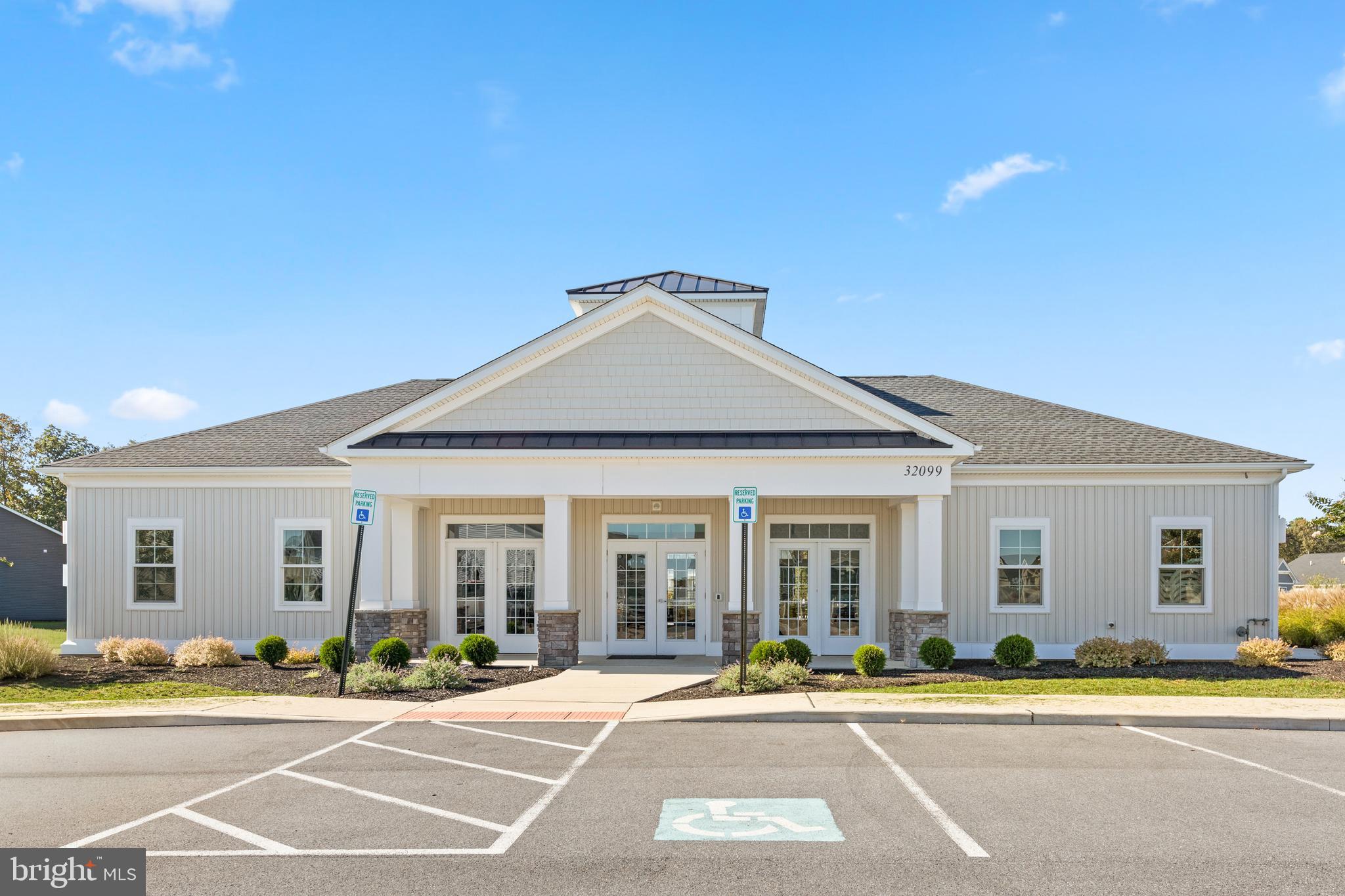 32225 Heritage Road Lewes, DE 19958 - Photo 70 of 74 a front view of a house with a garden and plants