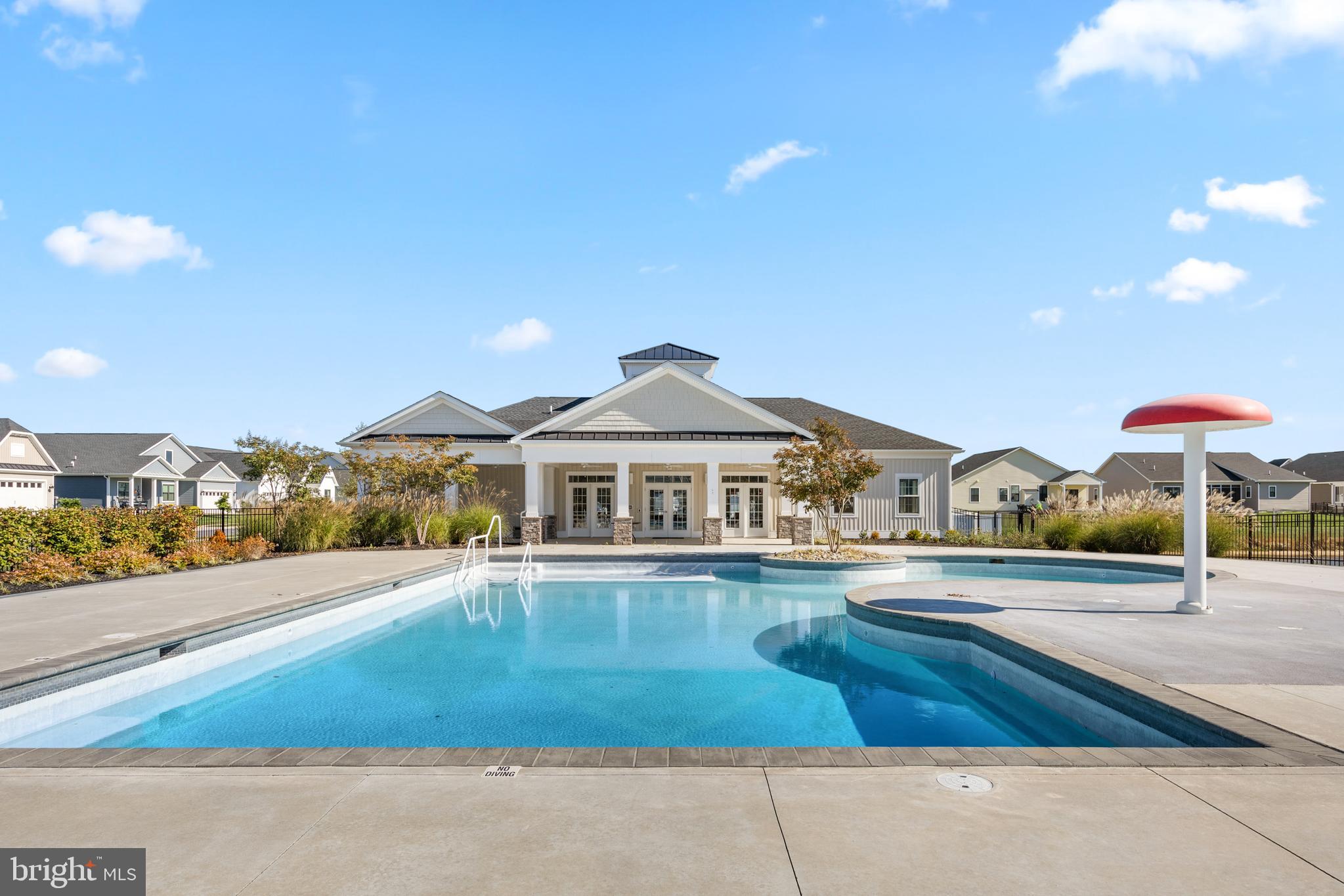 32225 Heritage Road Lewes, DE 19958 - Photo 73 of 74 a view of a house with a yard and balcony