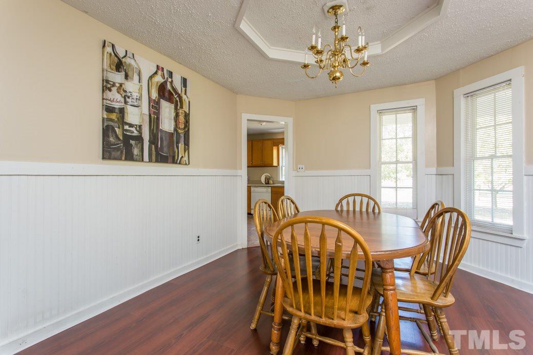 796 Old Eason Road Zebulon, NC 27597 - Photo 3 of 11 The formal dining room has direct access to the kitchen and family room. These open spaces are great for entertaining.