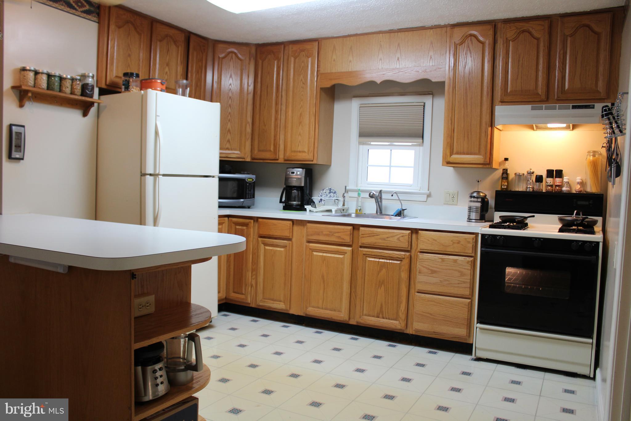 13361 Old Fort Road Fort Washington, MD 20744 - Photo 12 of 25 The kitchen features a gas stove, water filter