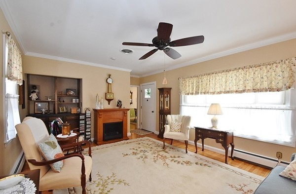 111 Hardy Pond Road Waltham, MA 02451 - Photo 10 of 15 a living room with furniture and a fireplace