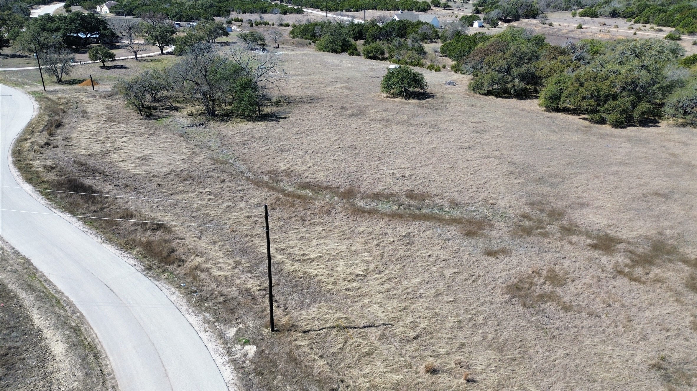 Lot 37 Garner Ranch Road Bertram, TX 78605 - Photo 7 of 15 a view of a dry yard with wooden fence