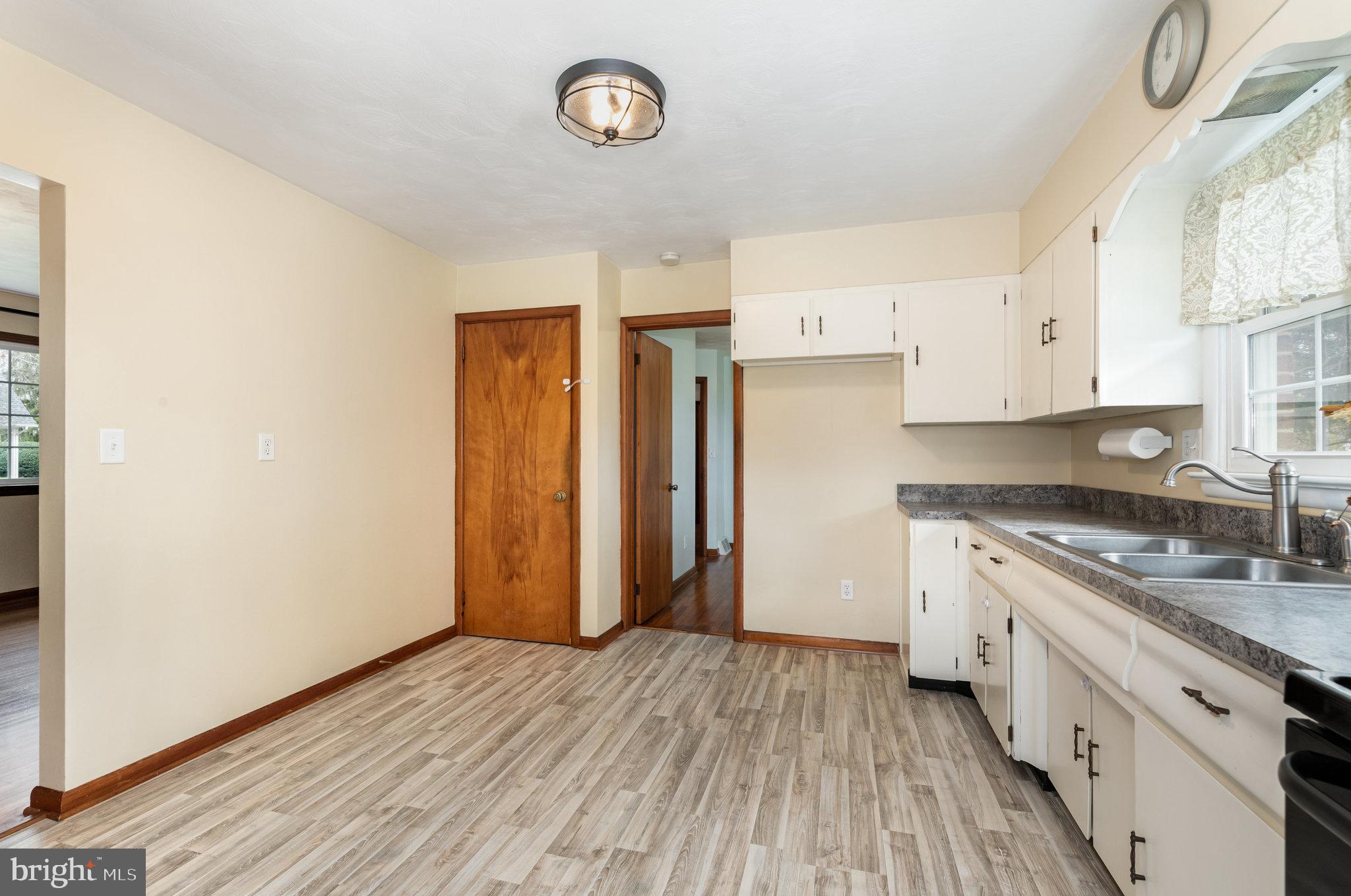 20 Chestnut Street Camp Hill, PA 17011 - Photo 12 of 26 a kitchen with a sink and a refrigerator