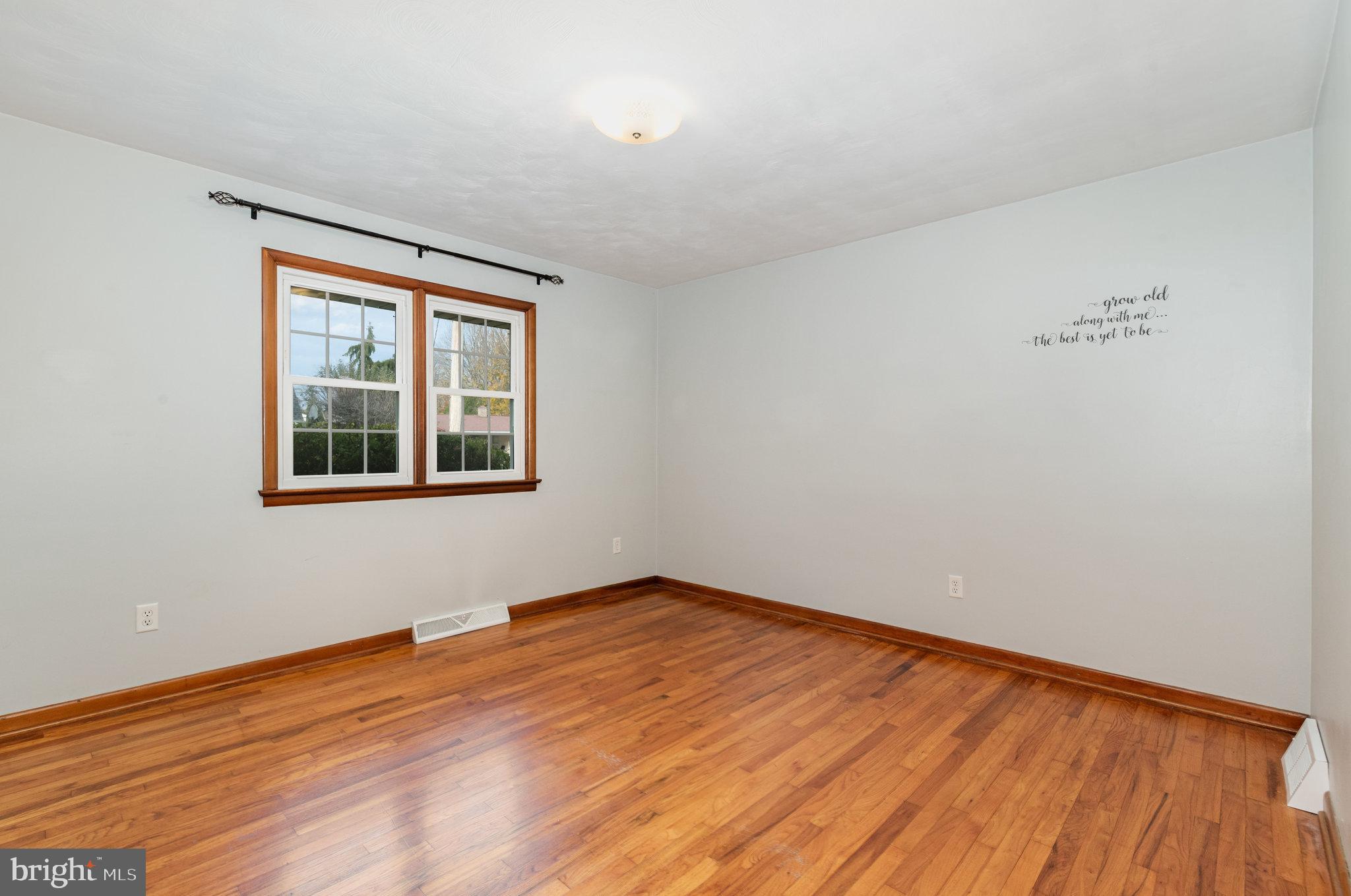 20 Chestnut Street Camp Hill, PA 17011 - Photo 13 of 26 a view of empty room with wooden floor and fan