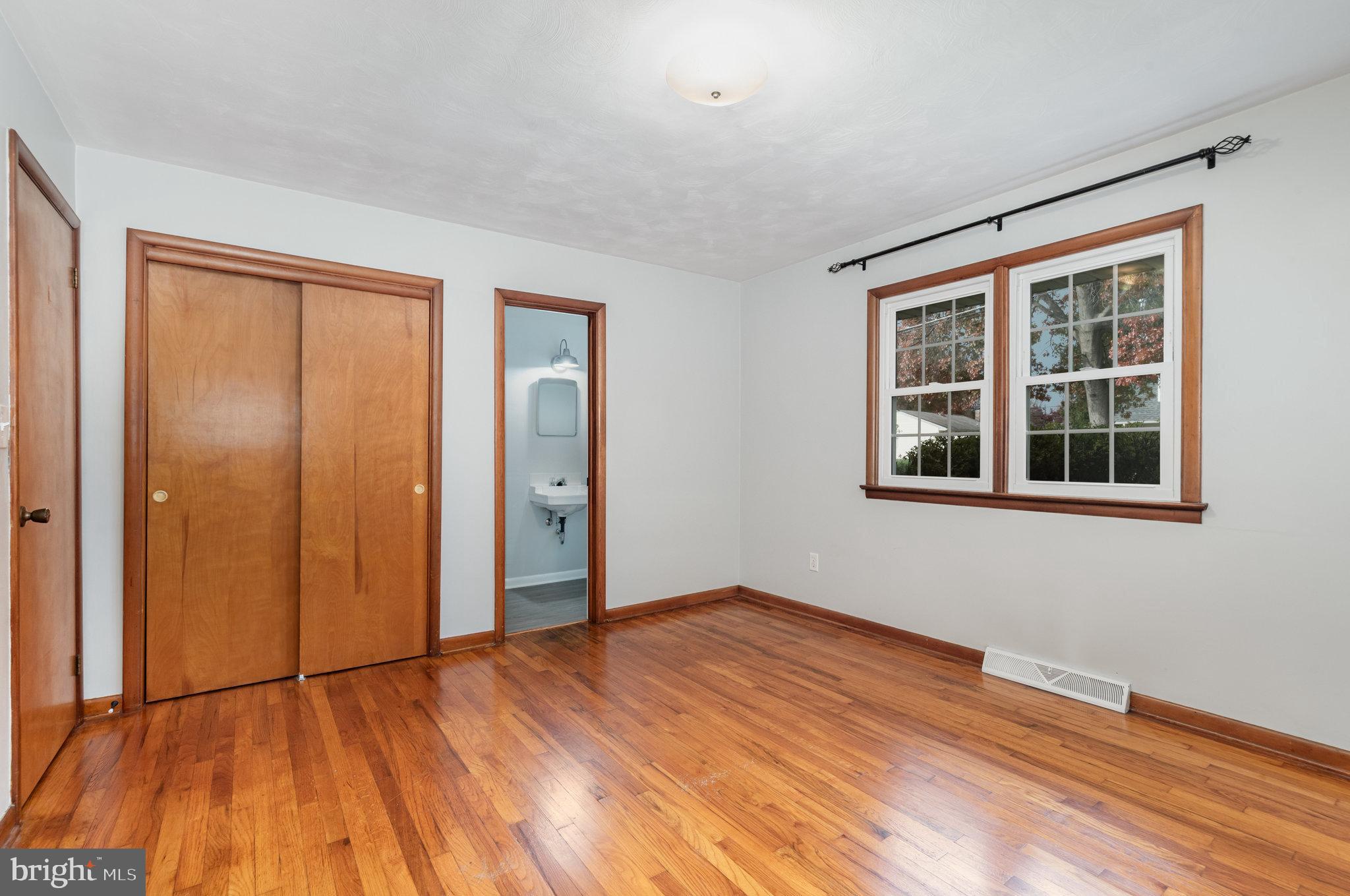 20 Chestnut Street Camp Hill, PA 17011 - Photo 14 of 26 a view of empty room with wooden floor and fan