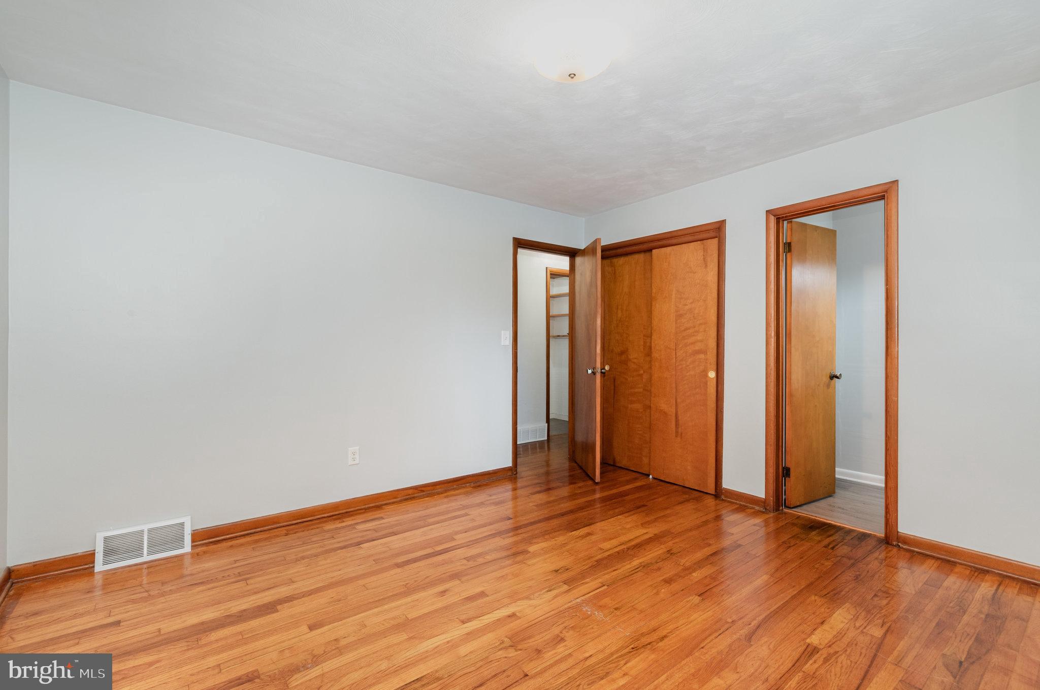 20 Chestnut Street Camp Hill, PA 17011 - Photo 15 of 26 an empty room with wooden floor and closet
