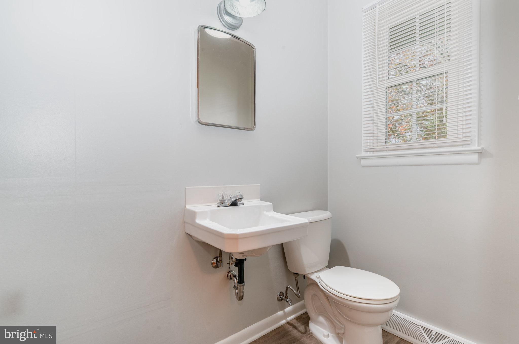20 Chestnut Street Camp Hill, PA 17011 - Photo 16 of 26 a bathroom with a sink toilet and a mirror