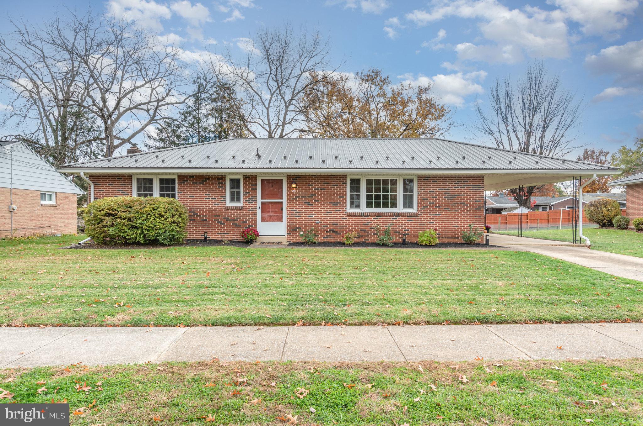 20 Chestnut Street Camp Hill, PA 17011 - Photo 2 of 26 a front view of a house with a garden
