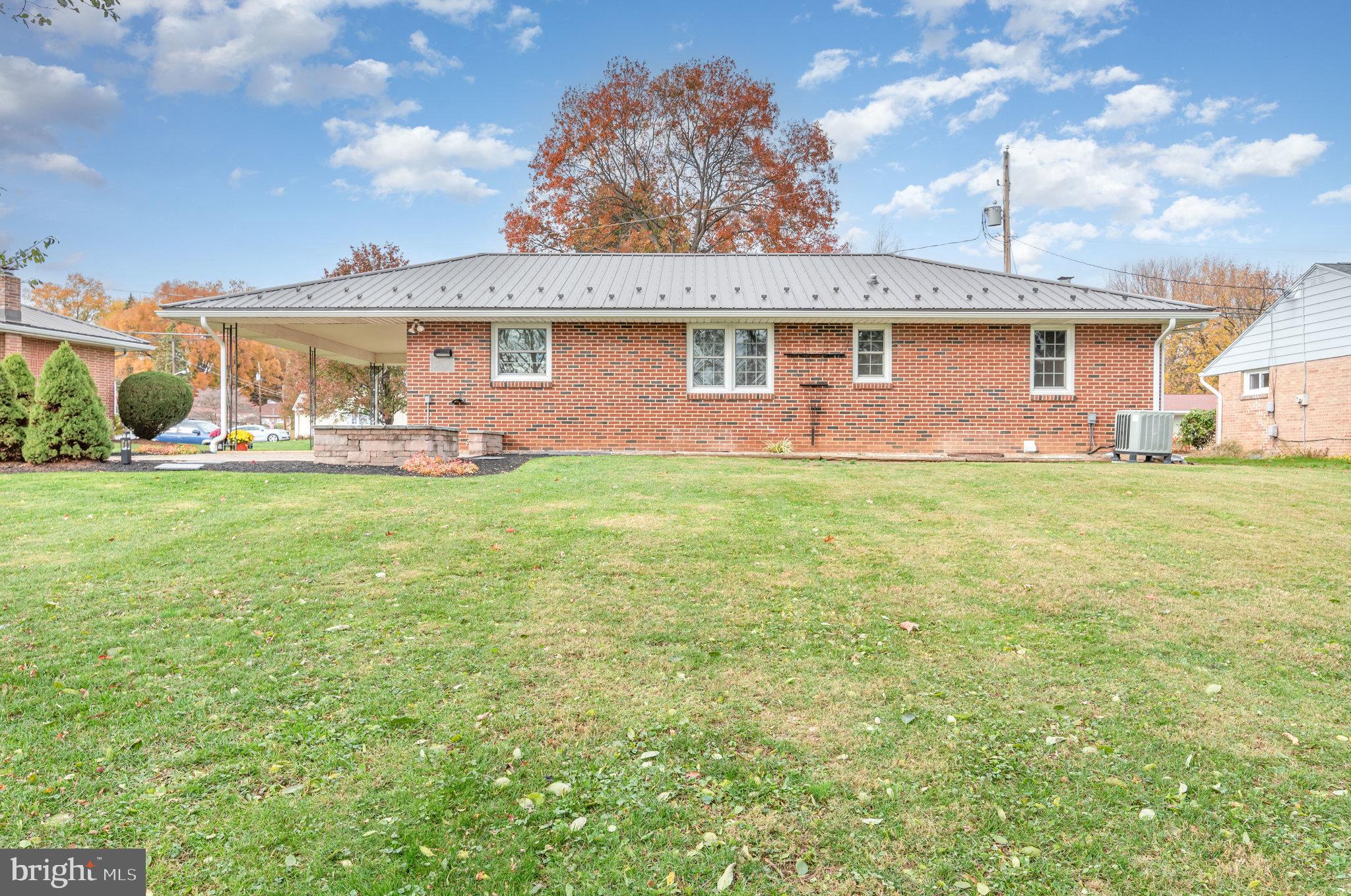 20 Chestnut Street Camp Hill, PA 17011 - Photo 24 of 26 a front view of a house with a garden and yard