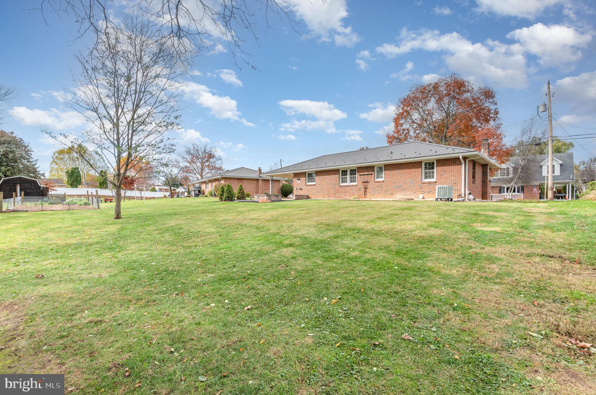 20 Chestnut Street Camp Hill, PA 17011 - Photo 25 of 26 a view of a house with a big yard and large trees